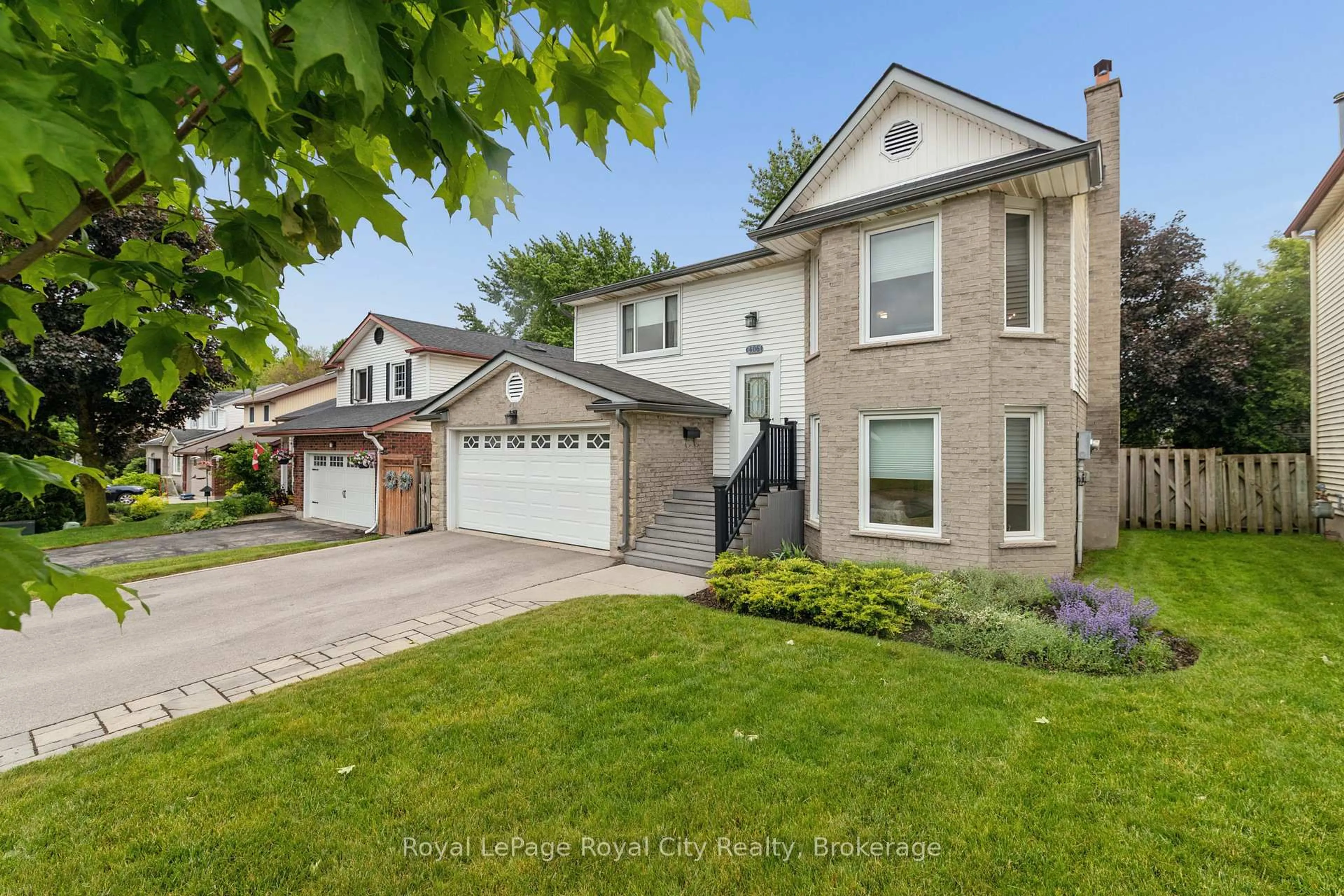 Home with vinyl exterior material, street for 406 Ironwood Rd, Guelph Ontario N1G 3N8