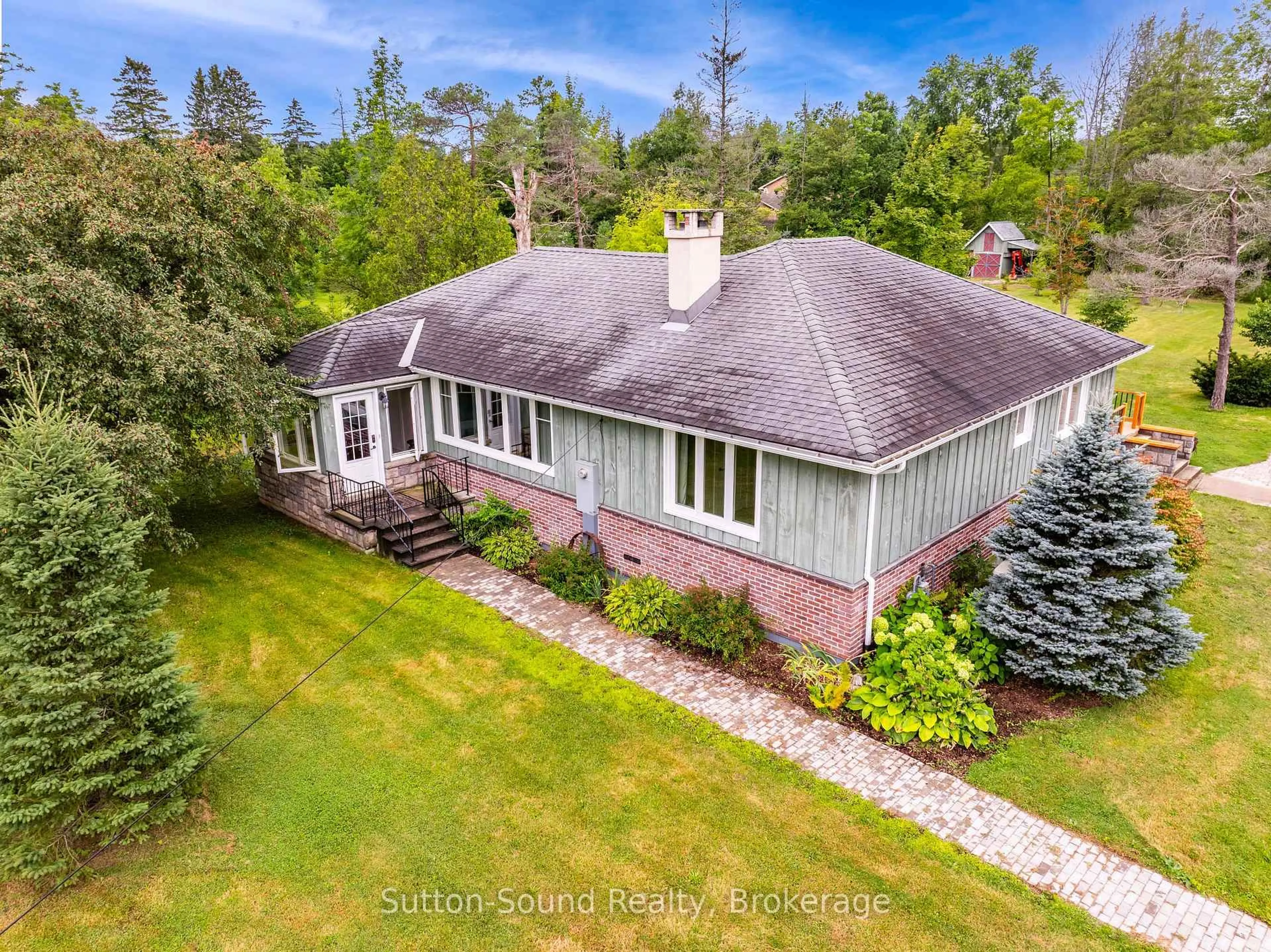 A pic from outside/outdoor area/front of a property/back of a property/a pic from drone, water/lake/river/ocean view for 827 13th St, Georgian Bluffs Ontario N4K 6V5
