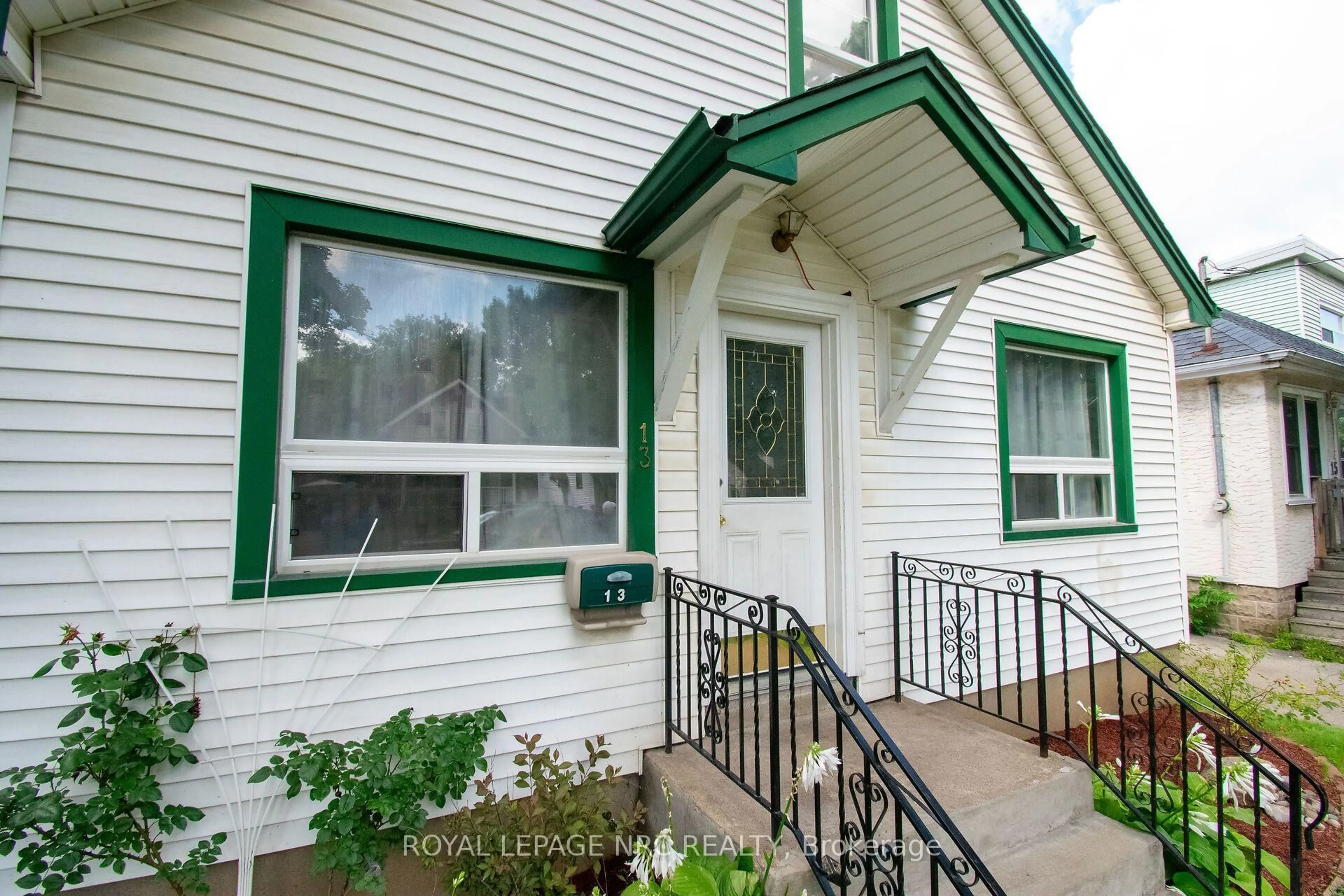 Home with vinyl exterior material, street for 13 Mildred Ave, St. Catharines Ontario L2R 6H9