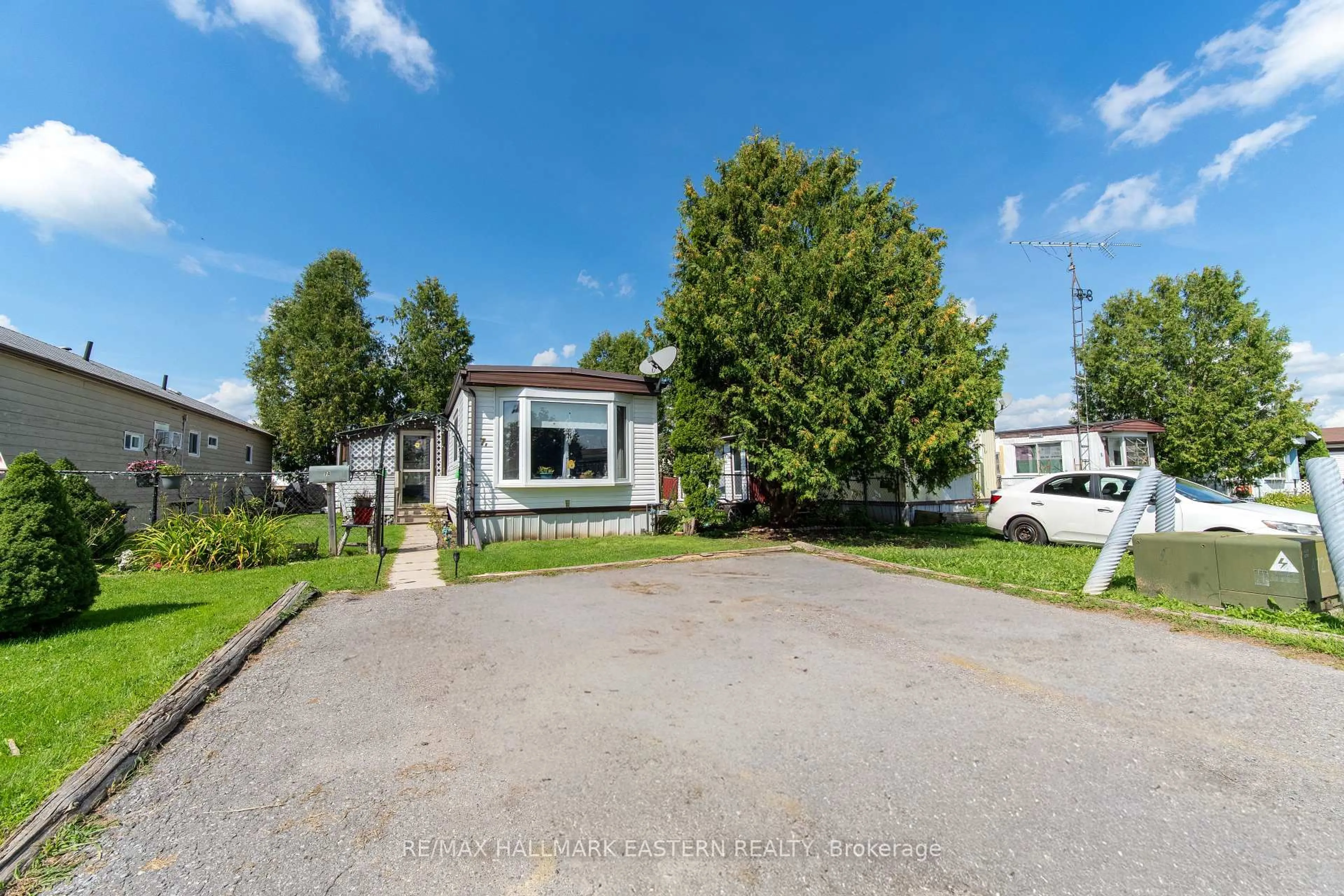 A pic from outside/outdoor area/front of a property/back of a property/a pic from drone, street for 2244 Heritage Line #7A, Otonabee-South Monaghan Ontario K9J 6X8