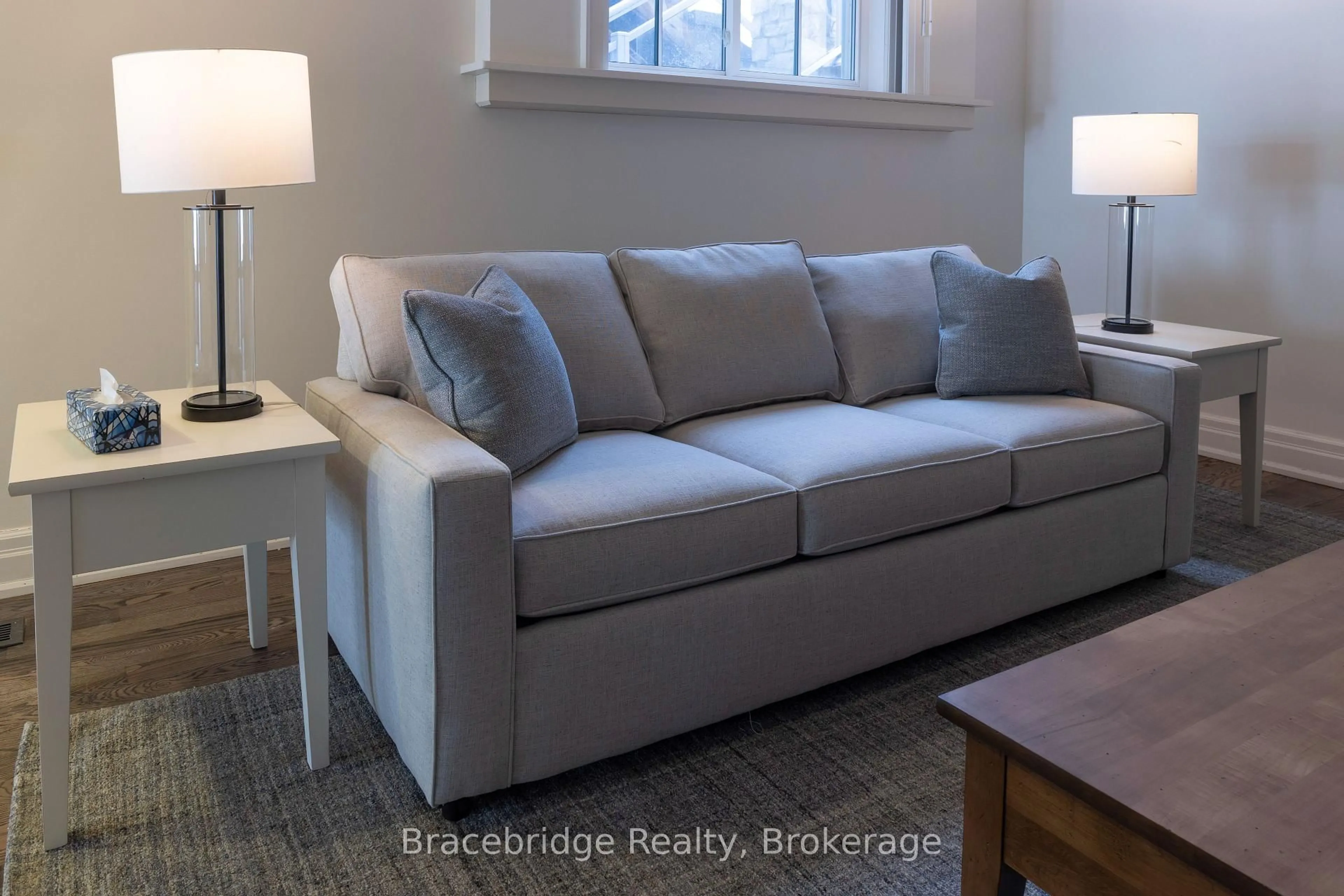 Living room with furniture, unknown for 1869 Muskoka Rd 118 Highway #B102-A1, Muskoka Lakes Ontario P1L 1W8