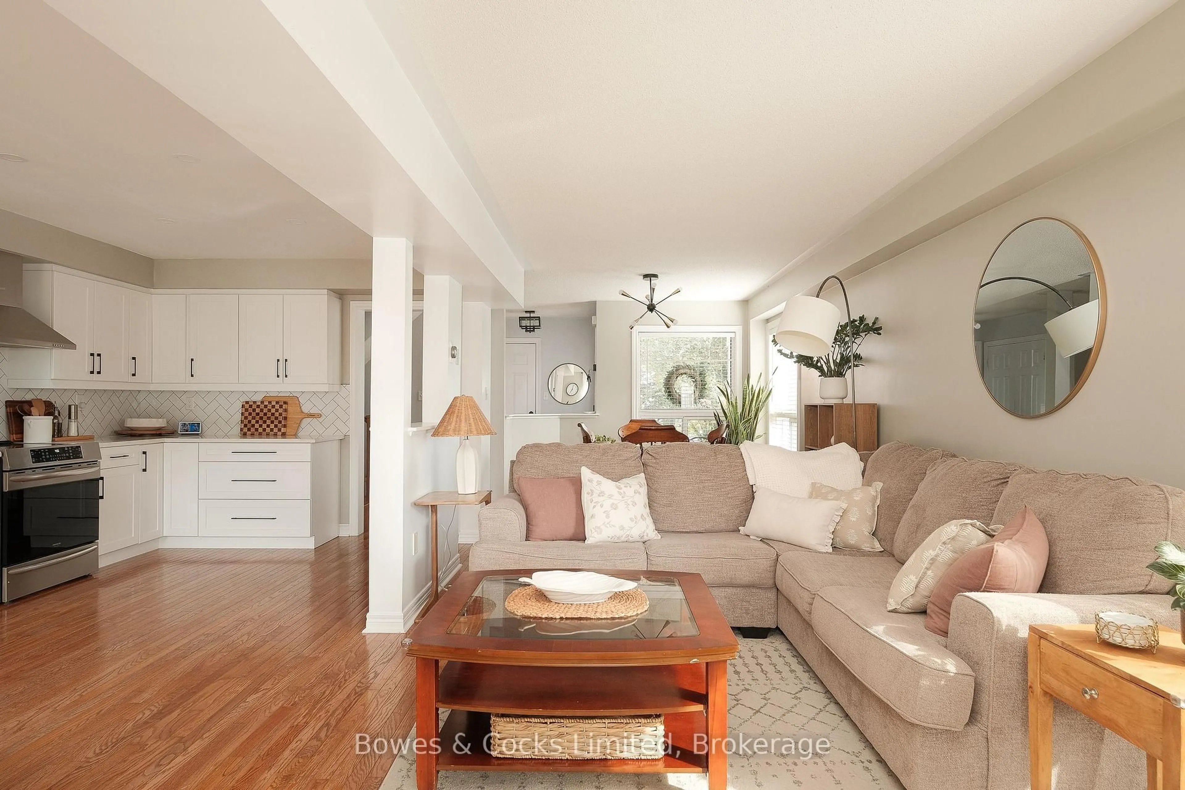 Living room with furniture, wood/laminate floor for 407 Spillsbury Dr, Peterborough Ontario K9K 2N6