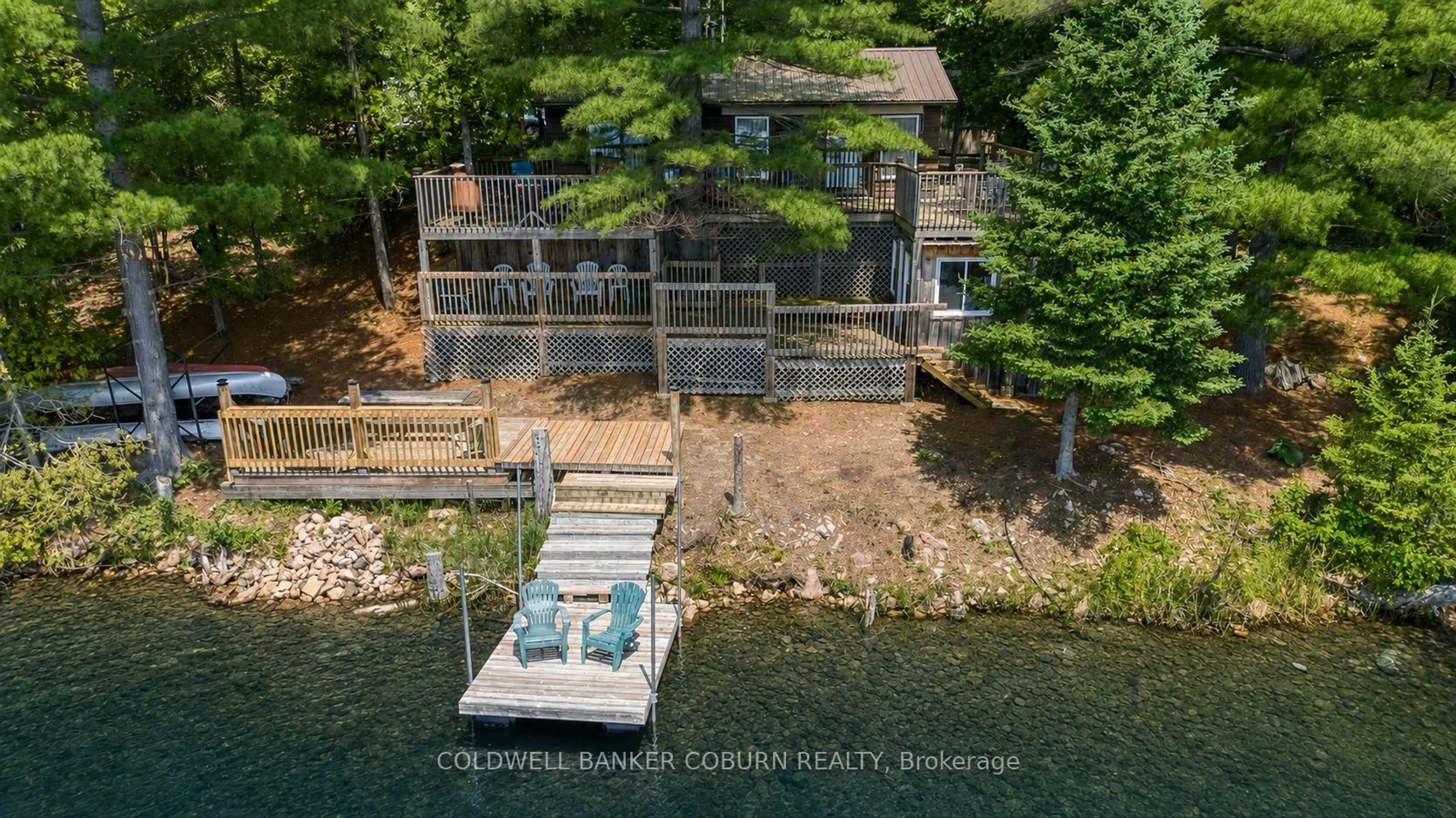 A pic from outside/outdoor area/front of a property/back of a property/a pic from drone, water/lake/river/ocean view for 1015 Oak Lane, Sharbot Lake Ontario K0H 2P0