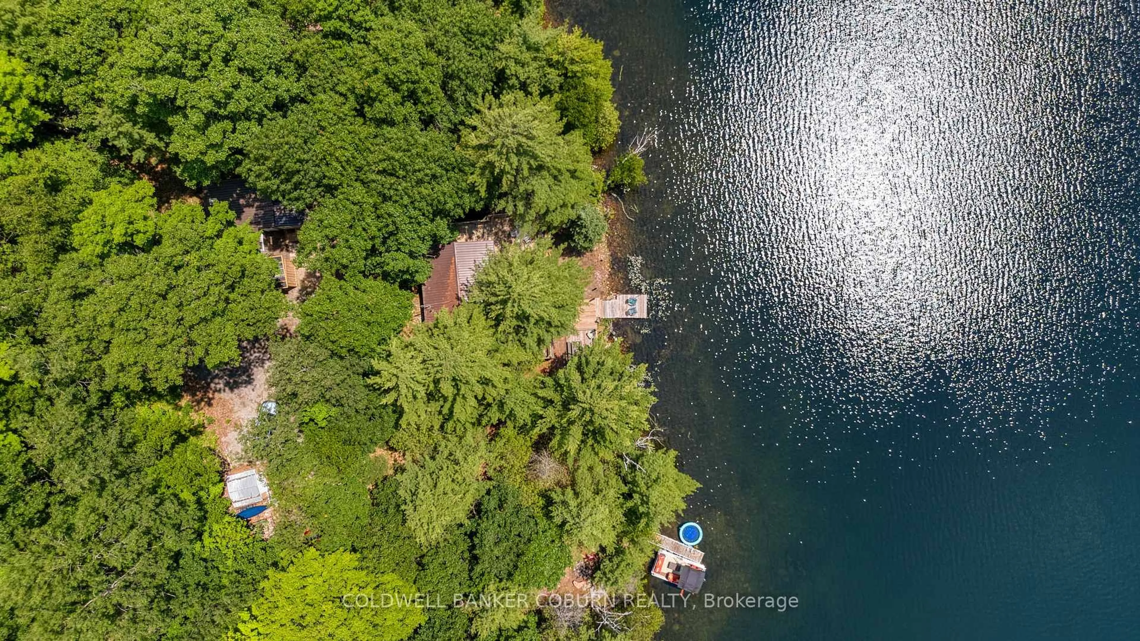 A pic from outside/outdoor area/front of a property/back of a property/a pic from drone, water/lake/river/ocean view for 1015 Oak Lane, Sharbot Lake Ontario K0H 2P0