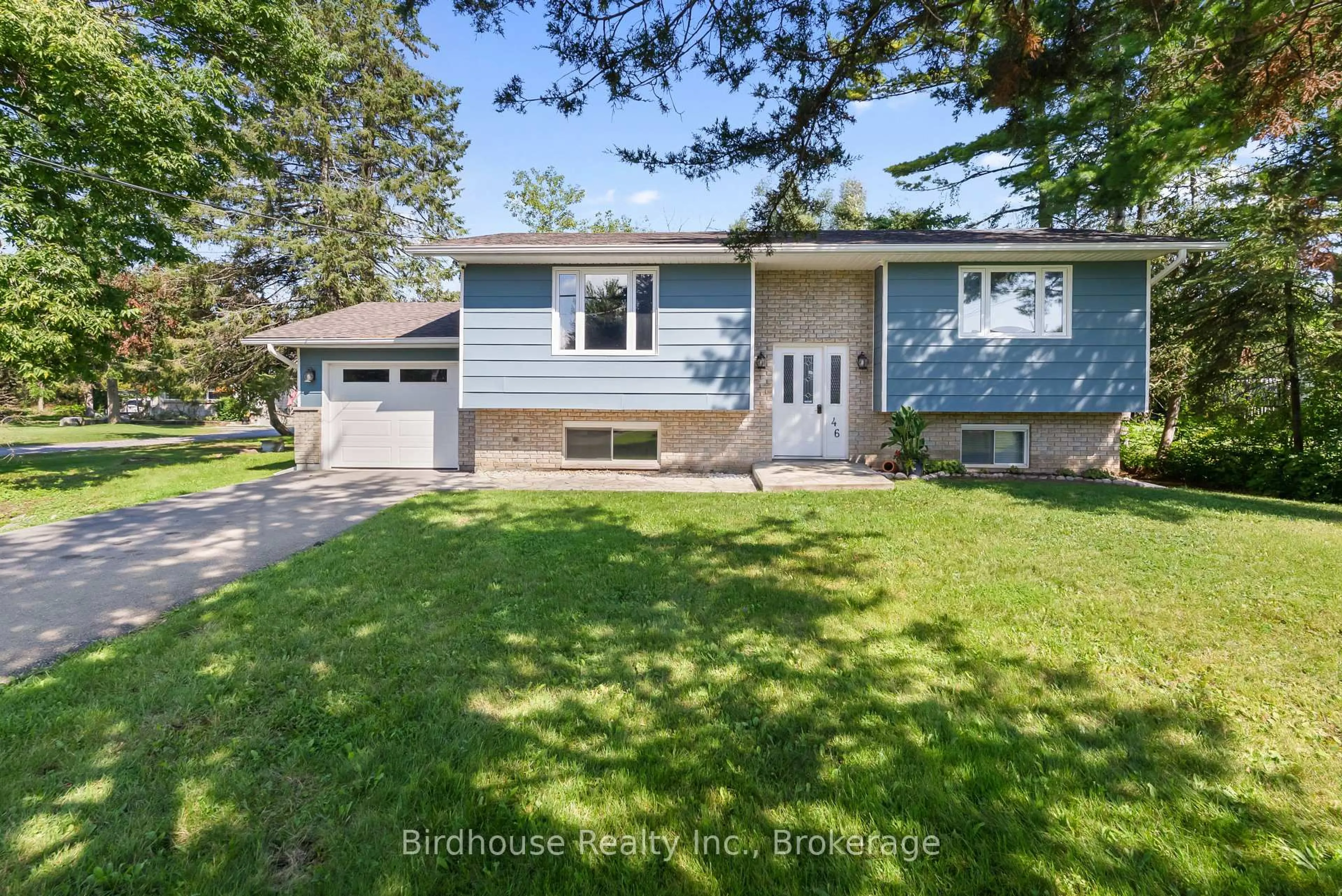 Home with vinyl exterior material, street for 46 Riverside Dr, Kawartha Lakes Ontario K0M 1A0