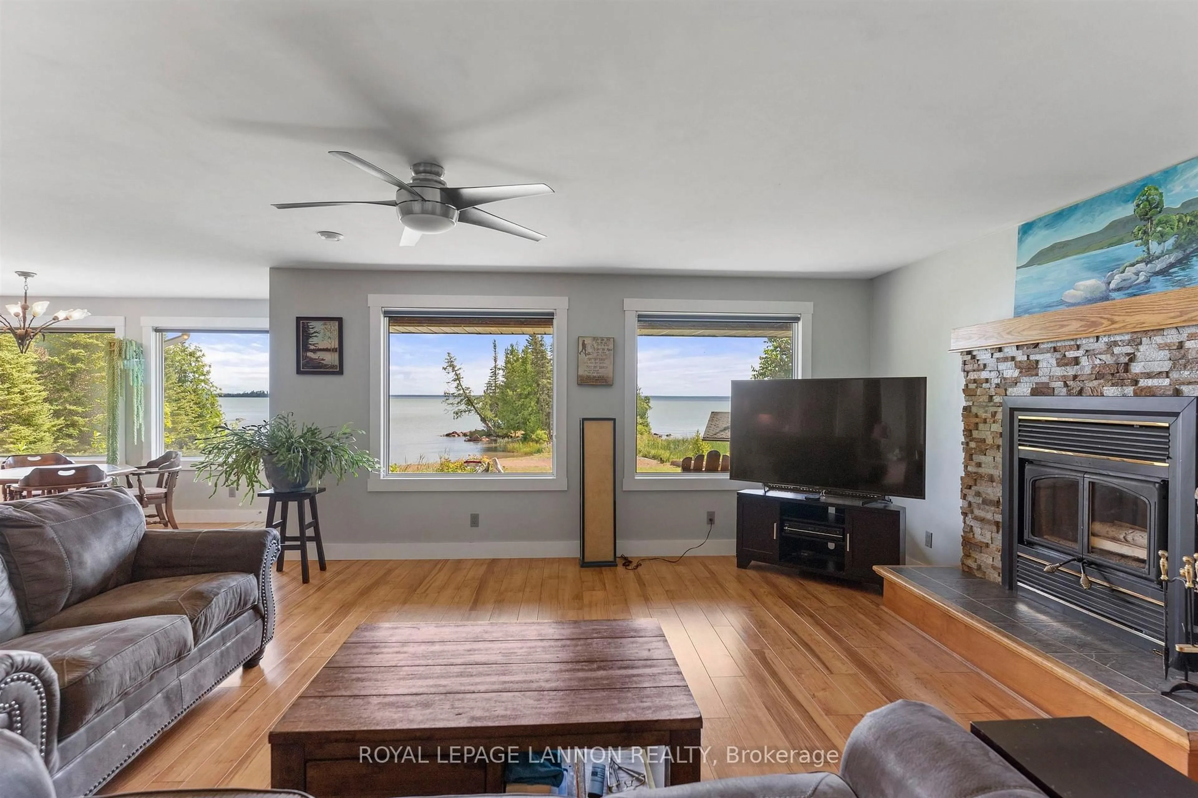 Living room with furniture, wood/laminate floor for 619 Grann Dr, Shuniah Ontario P0T 2M0