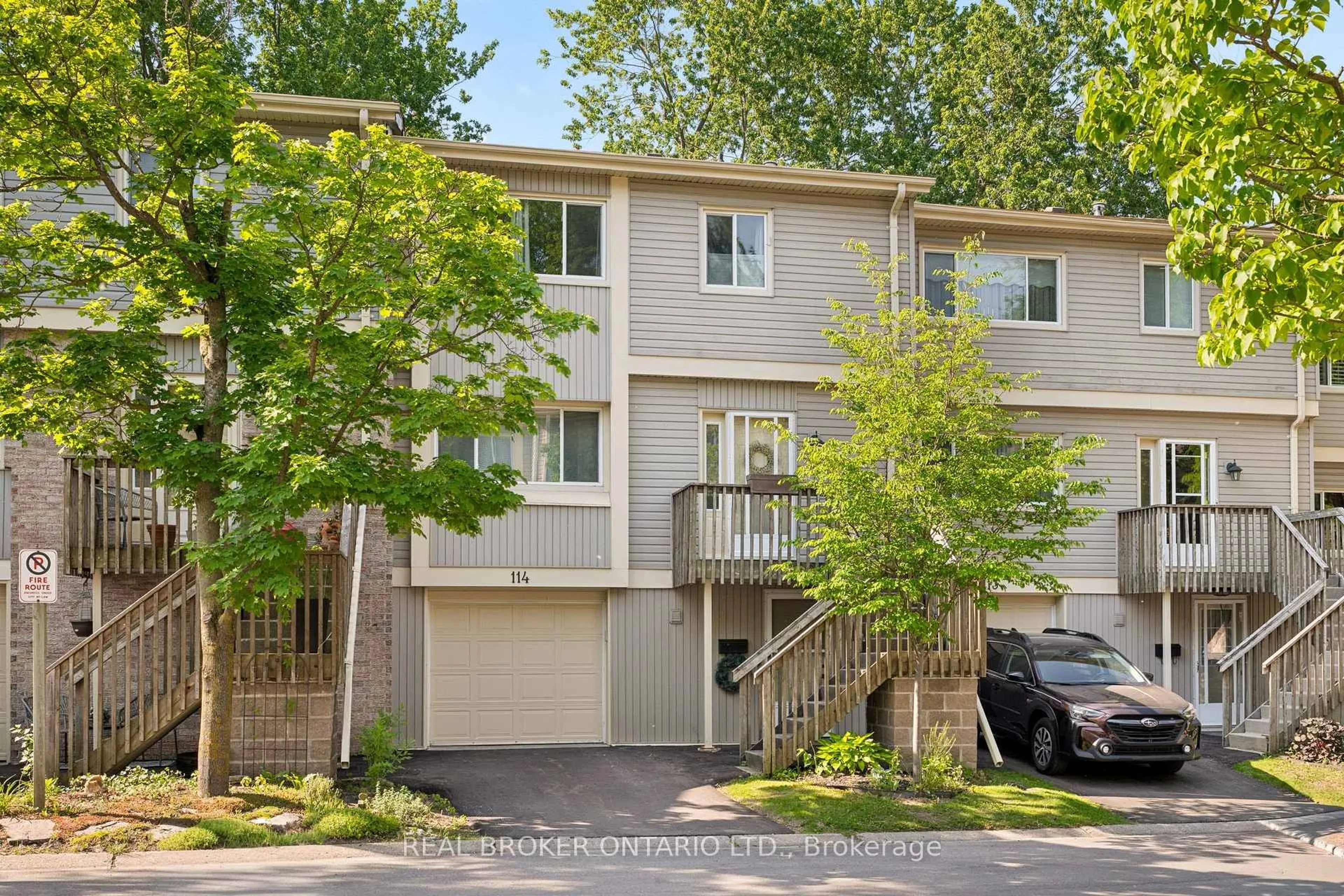 Home with vinyl exterior material, street for 30 Green Valley Dr #114, Kitchener Ontario N2P 1G8