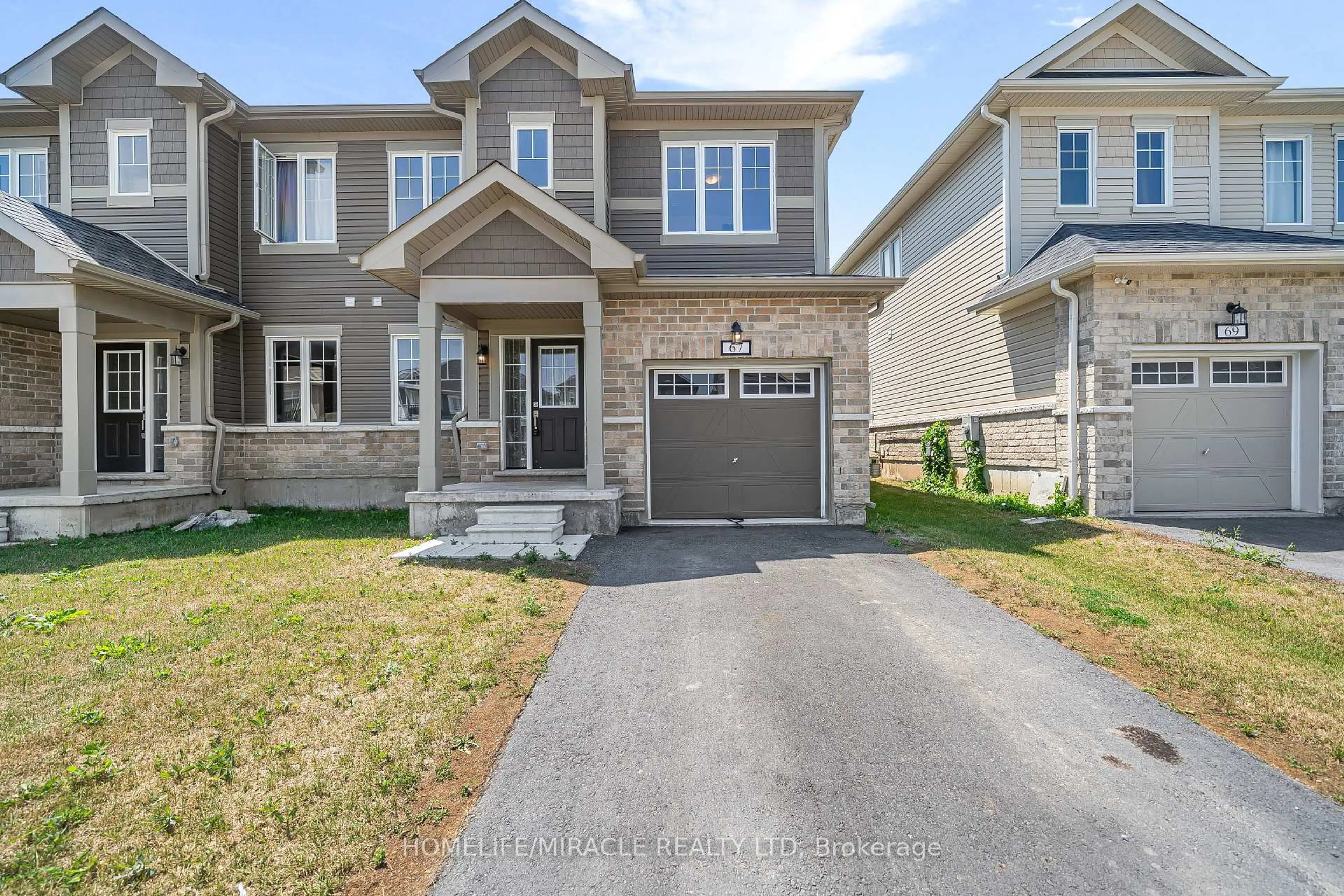 Home with brick exterior material, street for 67 Oakmont Dr, Bath Ontario K0H 1G0