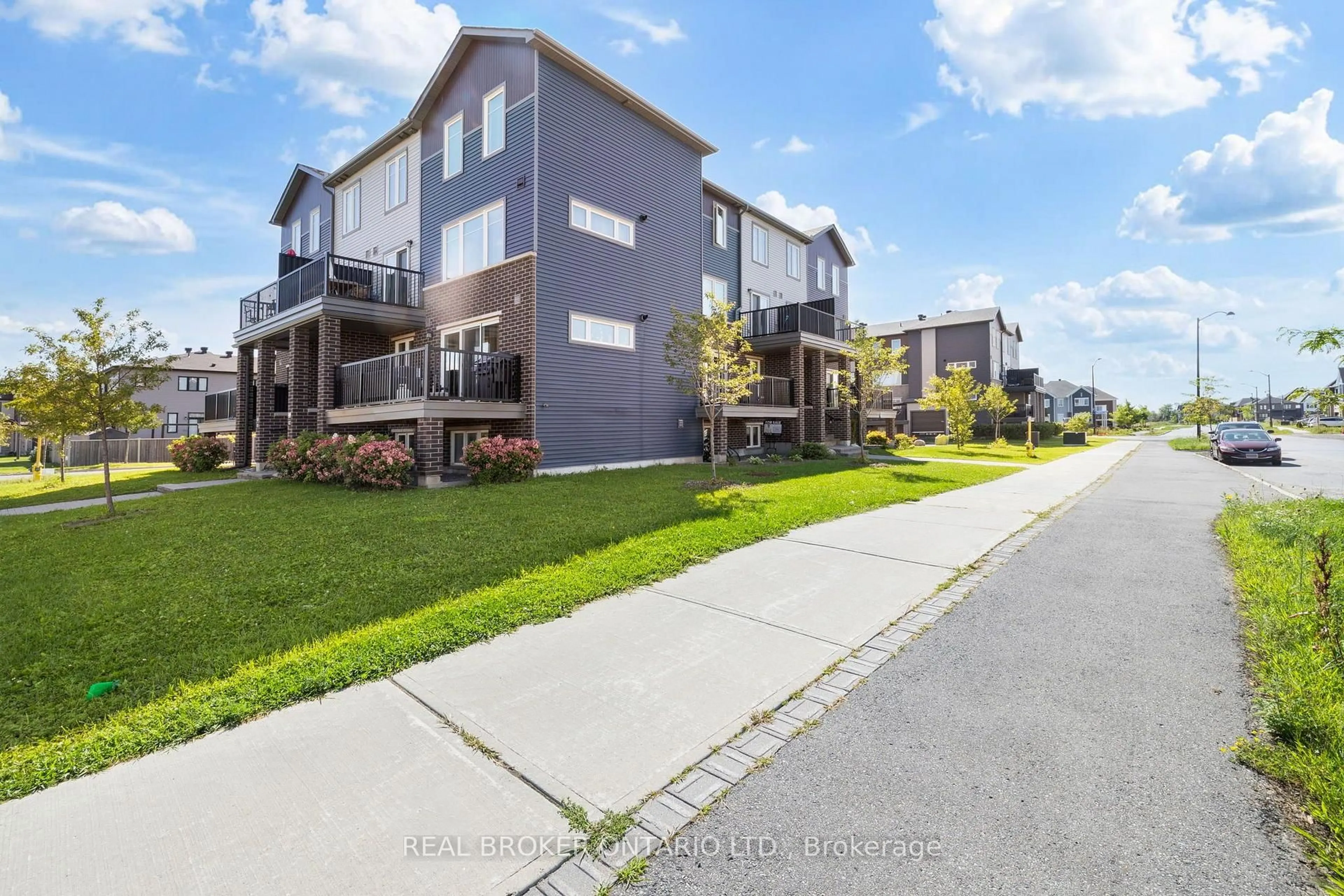 A pic from outside/outdoor area/front of a property/back of a property/a pic from drone, unknown for 1213 Chapman Mills Dr #2, Ottawa Ontario K2J 6R5