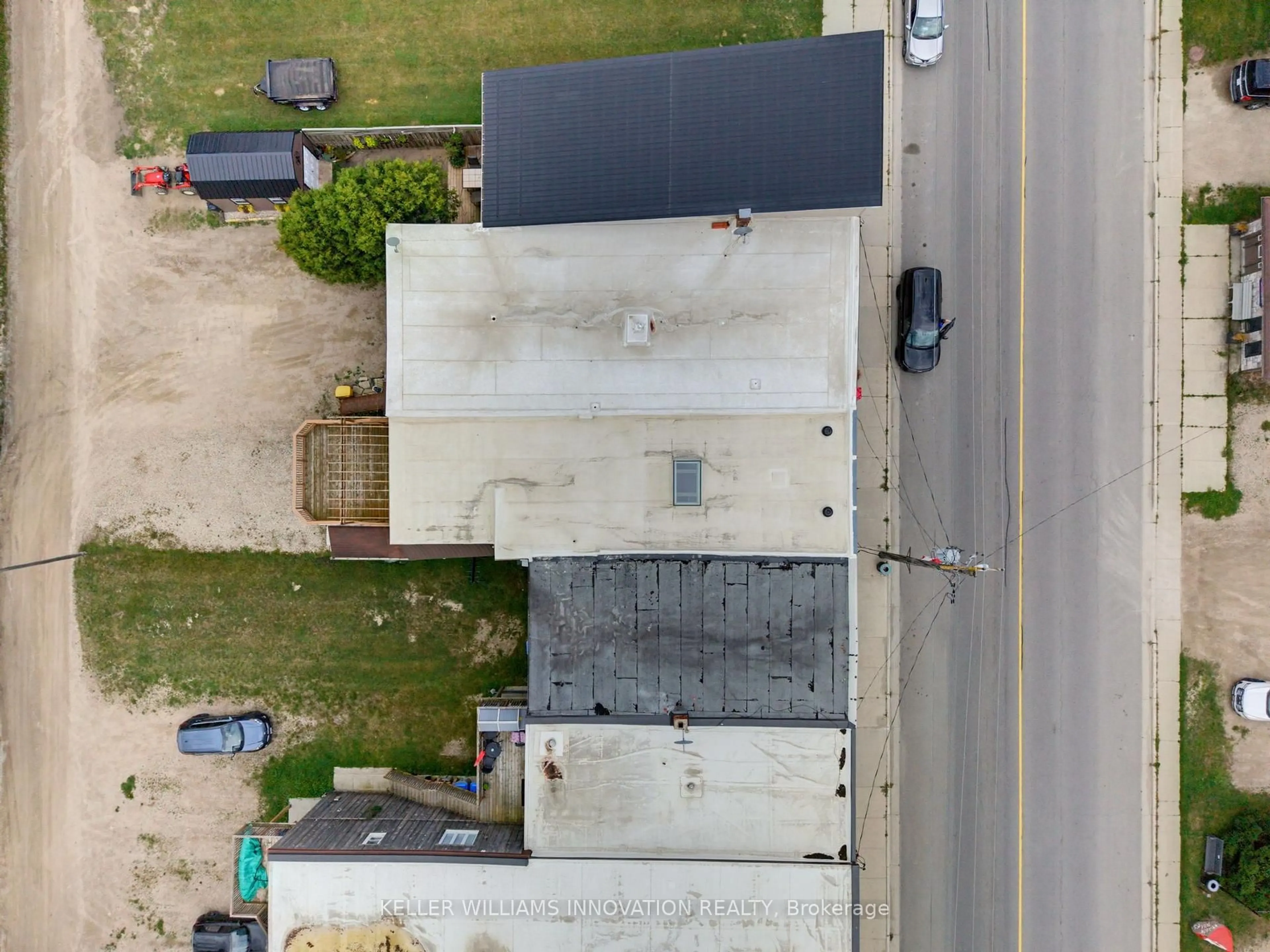 A pic from outside/outdoor area/front of a property/back of a property/a pic from drone, street for 216B Main St, North Perth Ontario N0G 1B0