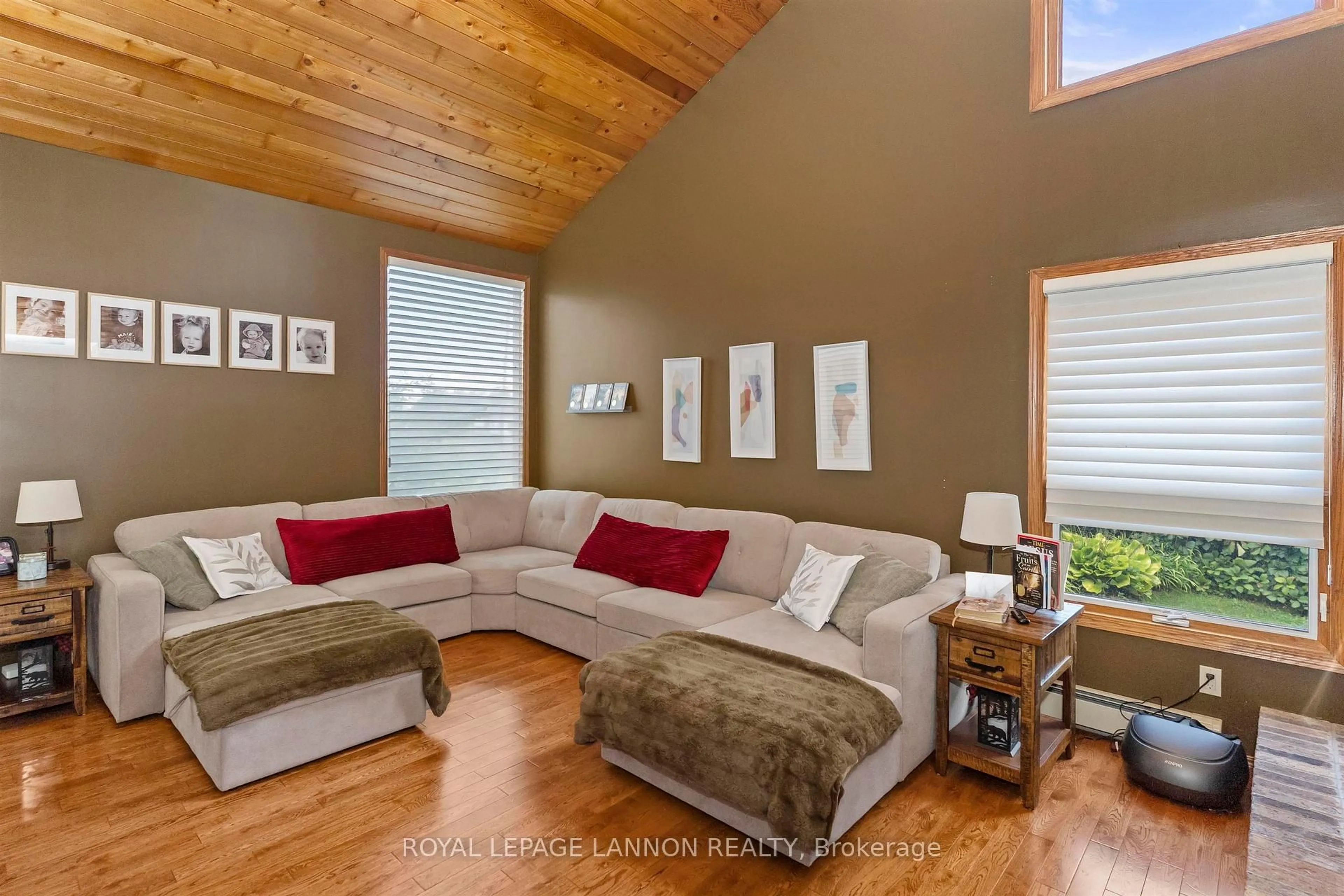 Living room with furniture, wood/laminate floor for 1702 Glenwood Cres, Thunder Bay Ontario P7K 1N3