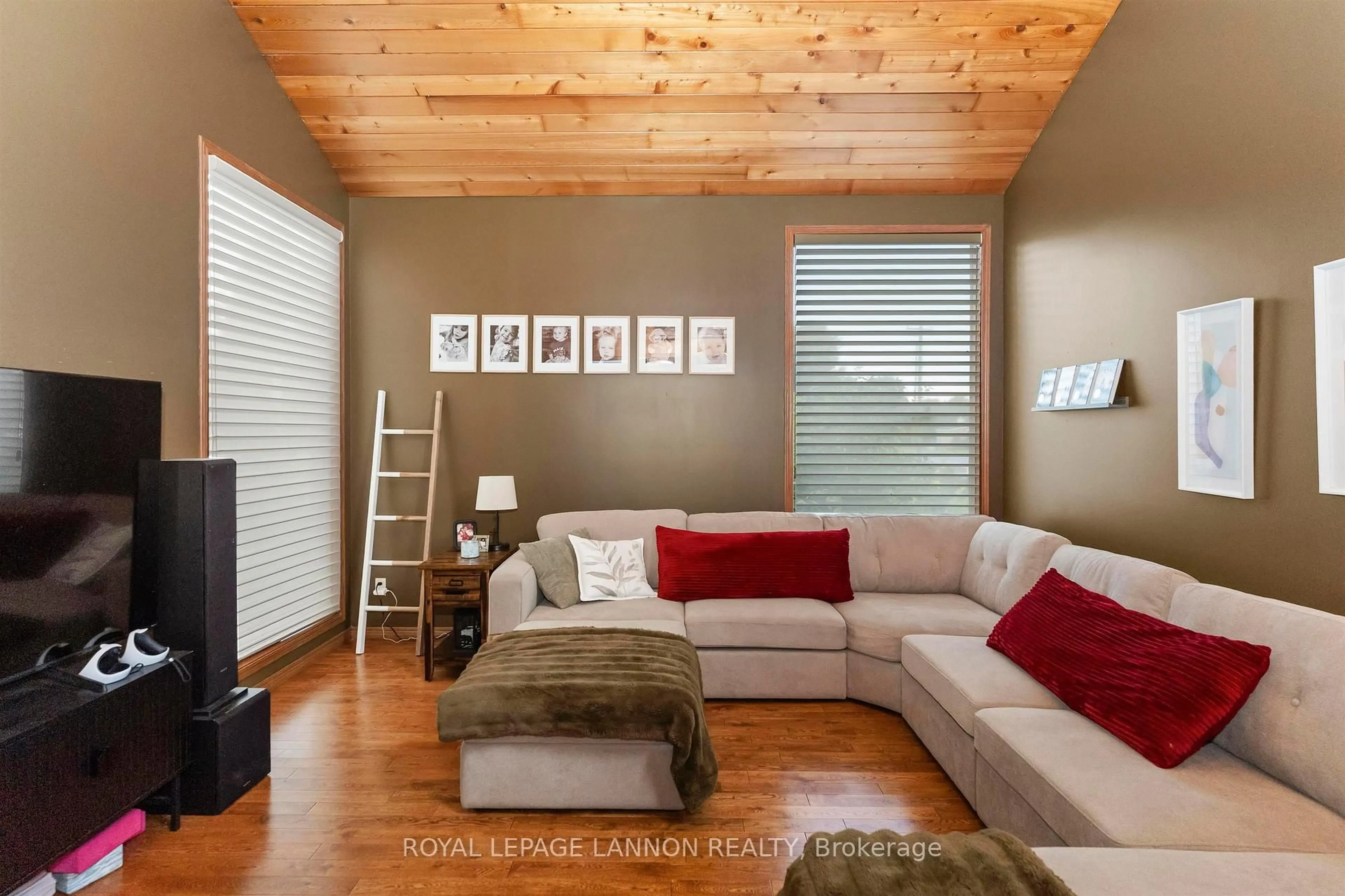 Living room with furniture, wood/laminate floor for 1702 Glenwood Cres, Thunder Bay Ontario P7K 1N3