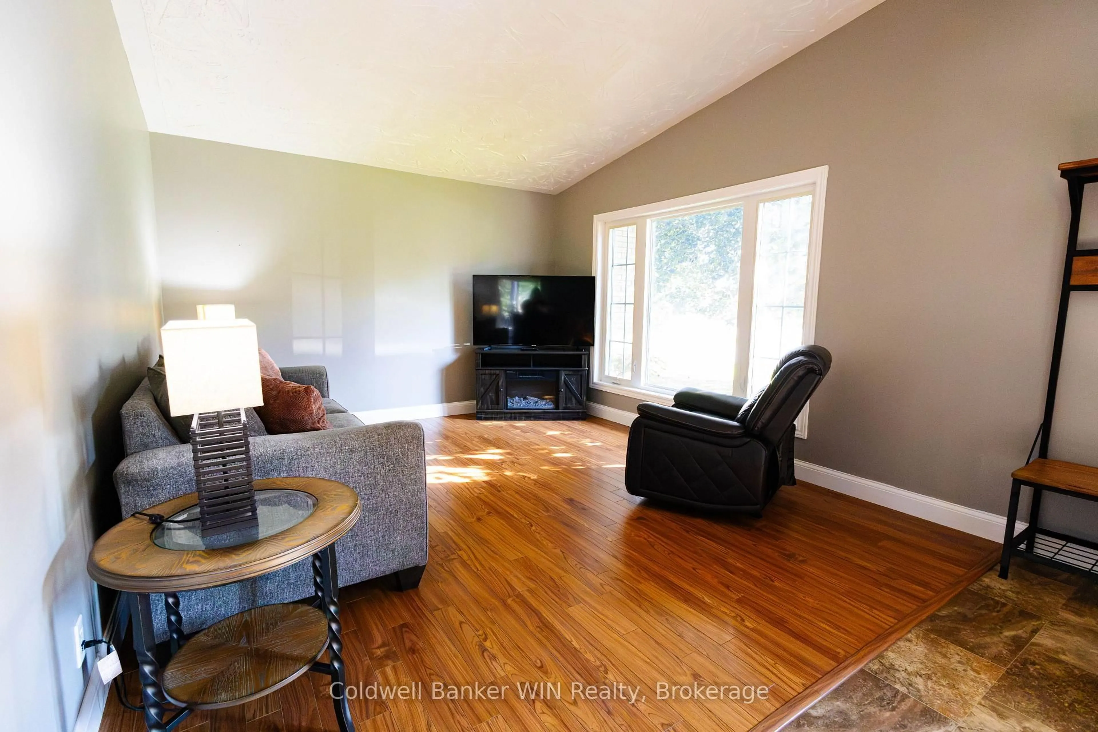 Living room with furniture, wood/laminate floor for 25 Thomas St, South Bruce Ontario N0G 2S0