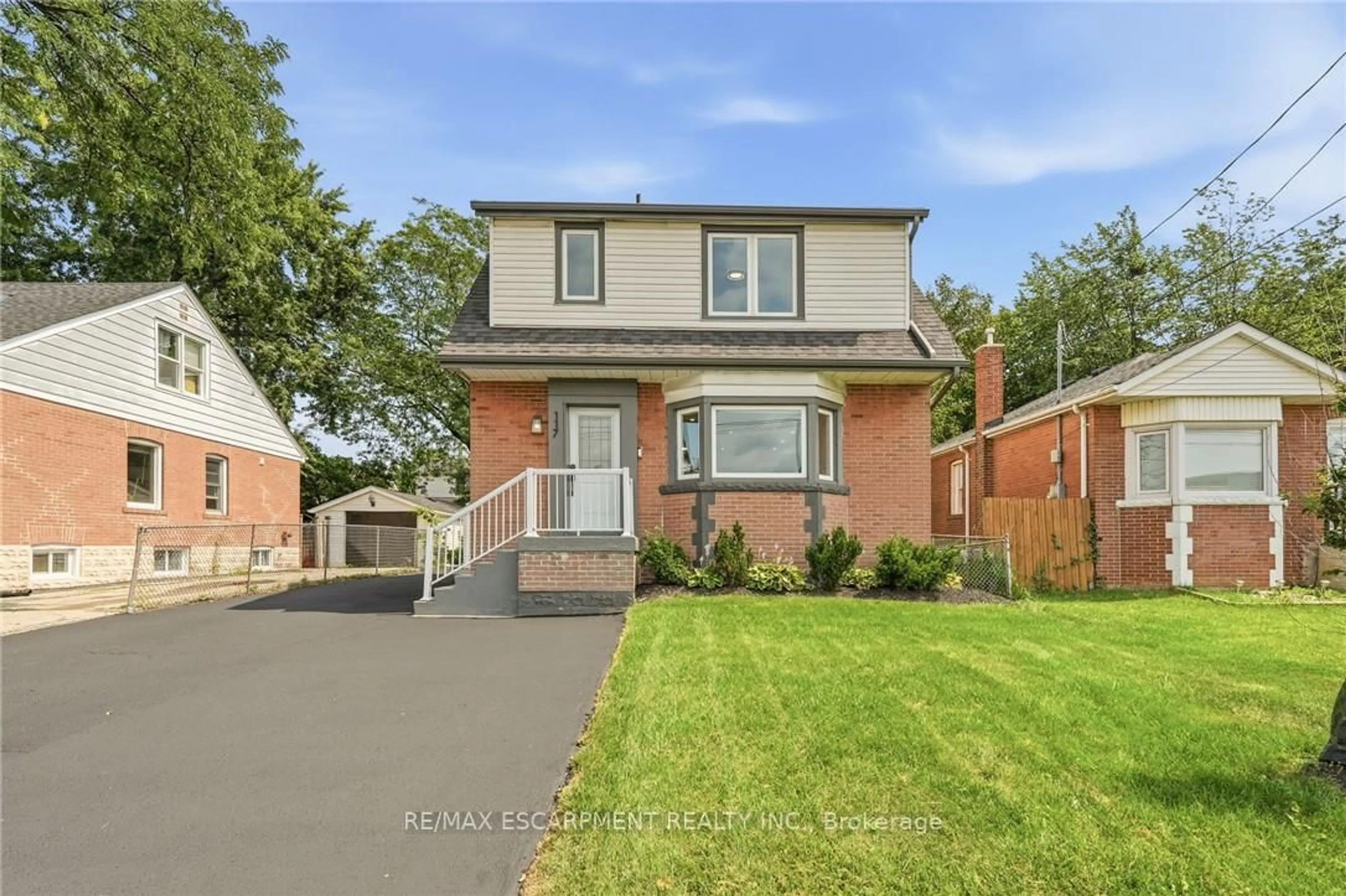 Home with brick exterior material, street for 117 West 5th St, Hamilton Ontario L9C 3N7