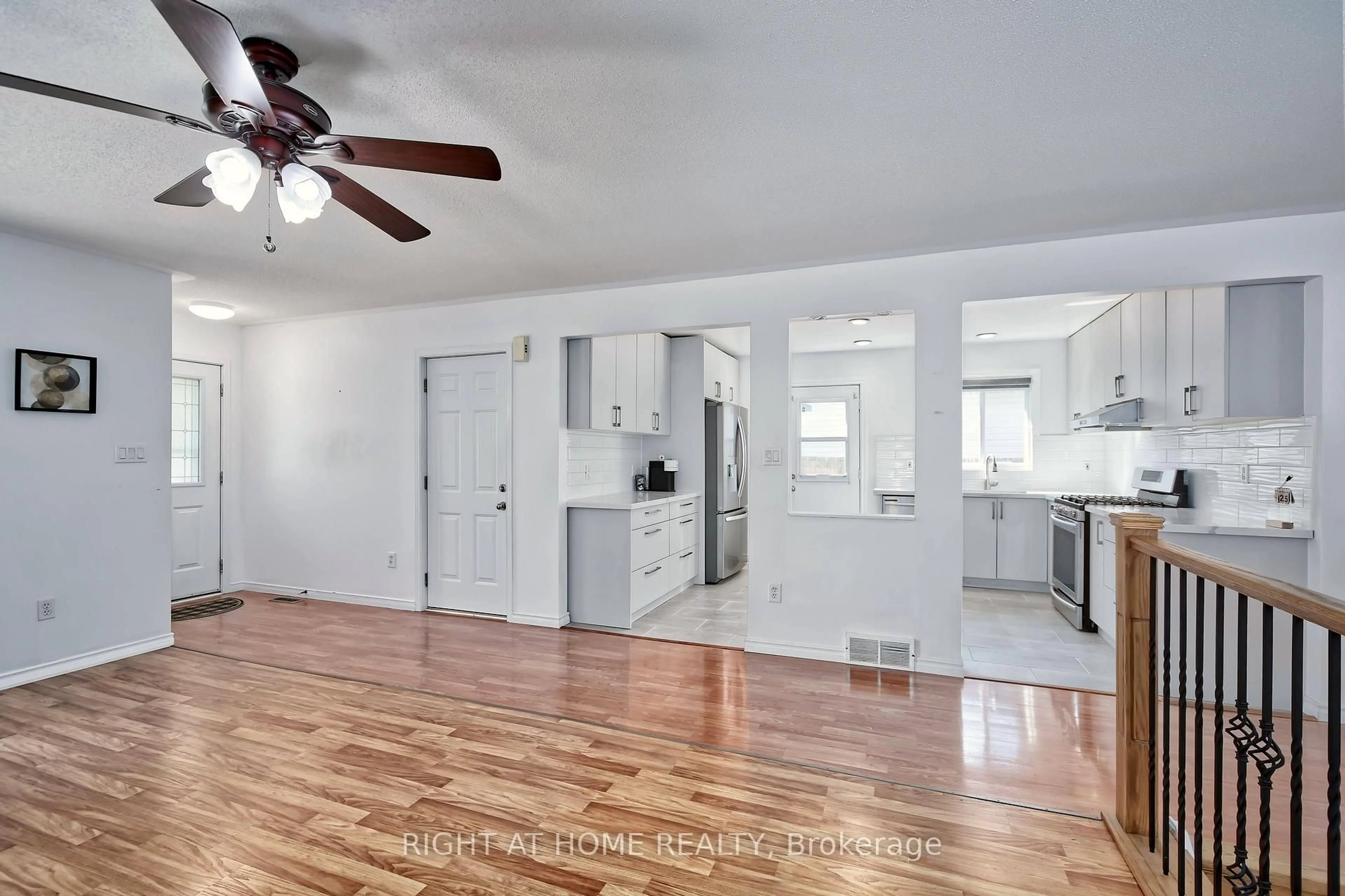 Open concept kitchen, wood/laminate floor for 896 Fogerty St, London North Ontario N5X 4G6