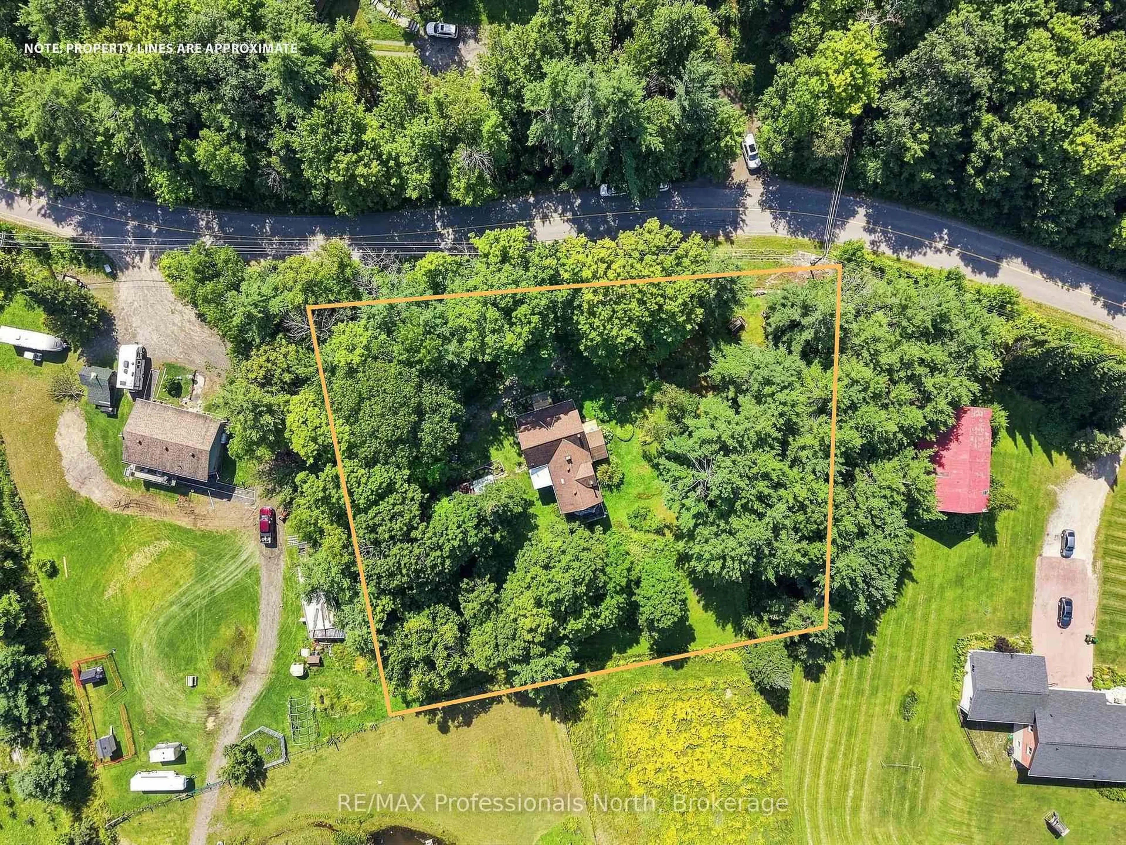 A pic from outside/outdoor area/front of a property/back of a property/a pic from drone, forest/trees view for 1110 Golden Beach Rd, Bracebridge Ontario P1L 1W8