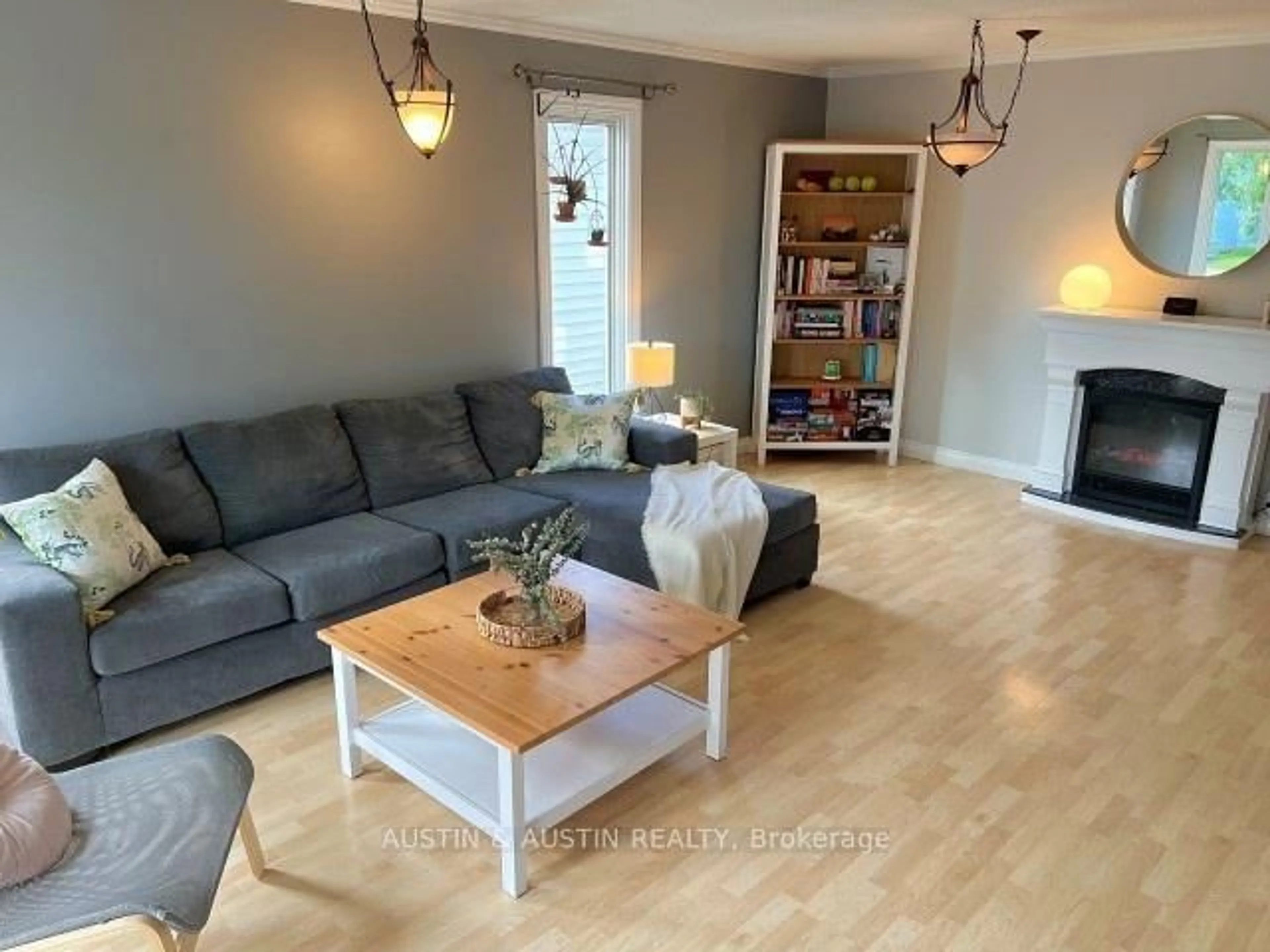 Living room with furniture, wood/laminate floor for 31 Mario Milanese Pl, Dryden Ontario P8N 3G8