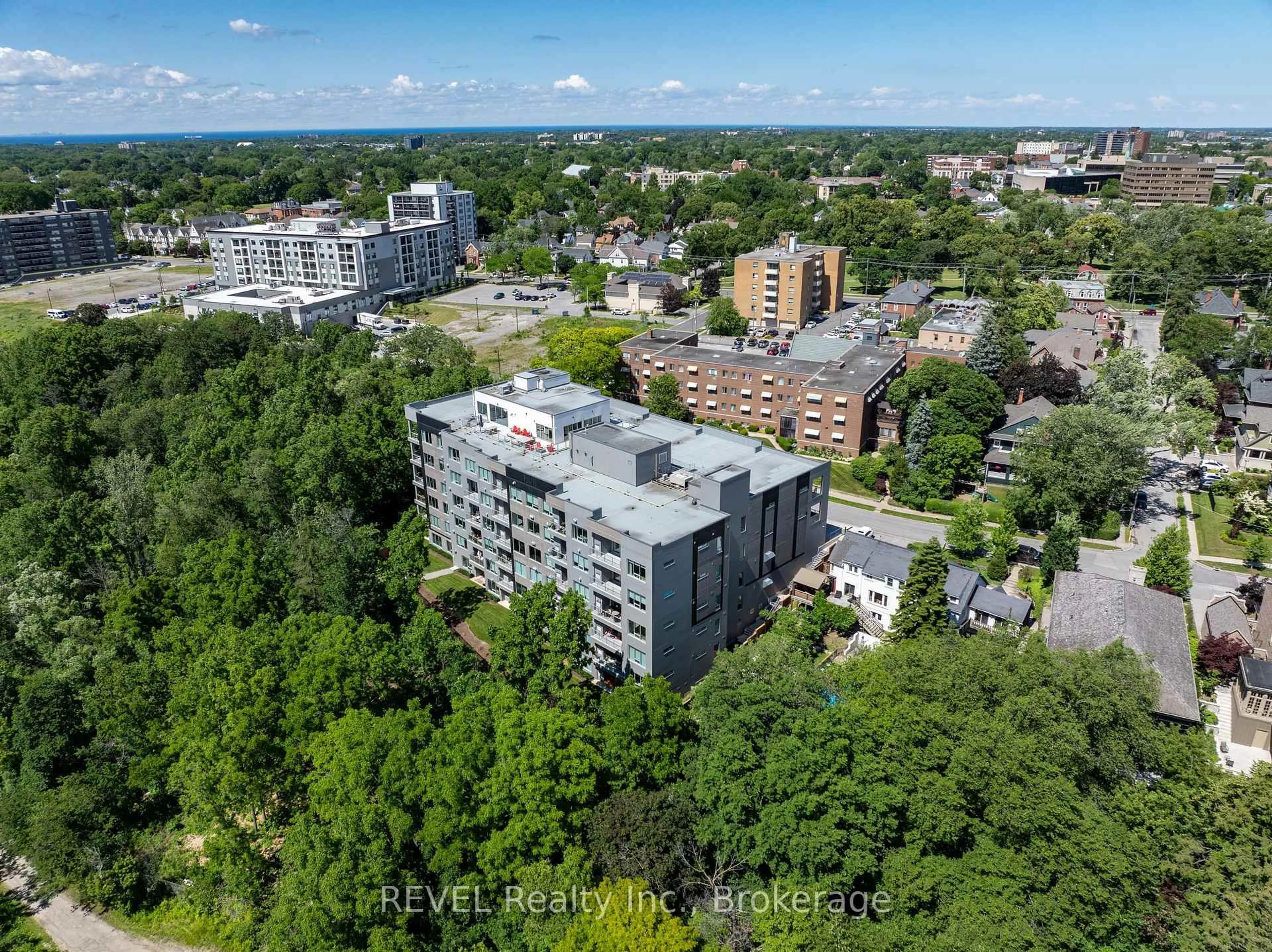 A pic from outside/outdoor area/front of a property/back of a property/a pic from drone, city buildings view from balcony for 77 Yates St #606, St. Catharines Ontario L2R 5R7