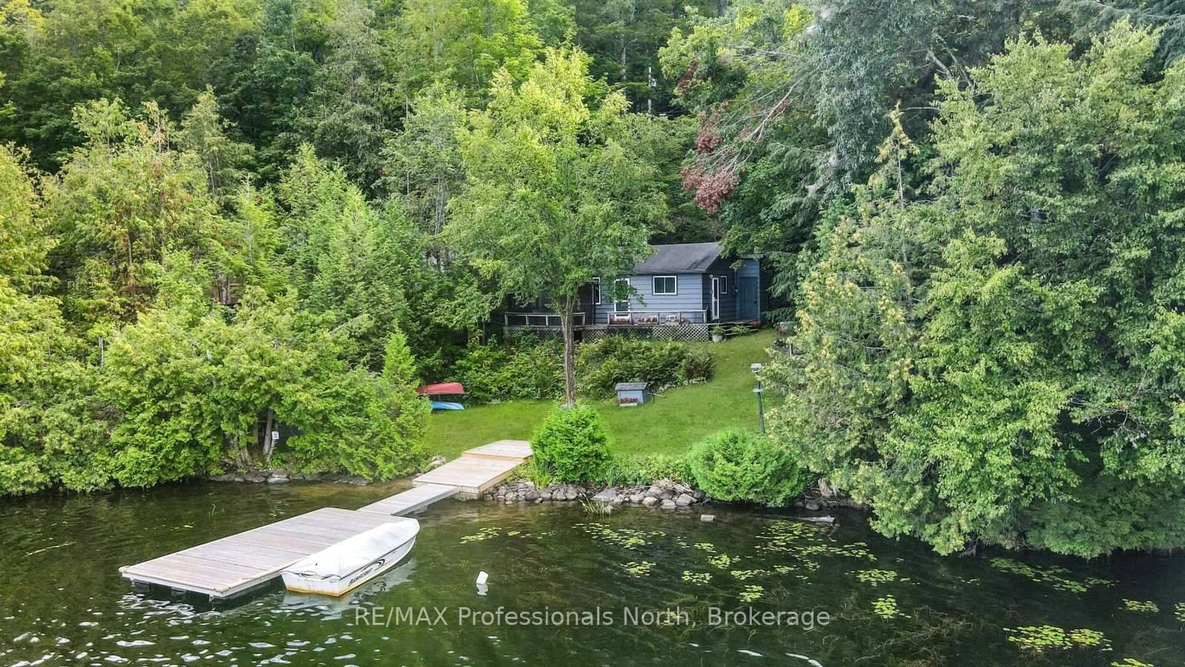 A pic from outside/outdoor area/front of a property/back of a property/a pic from drone, water/lake/river/ocean view for 1017 Pickerel Lane, Highlands East Ontario K0M 1X0