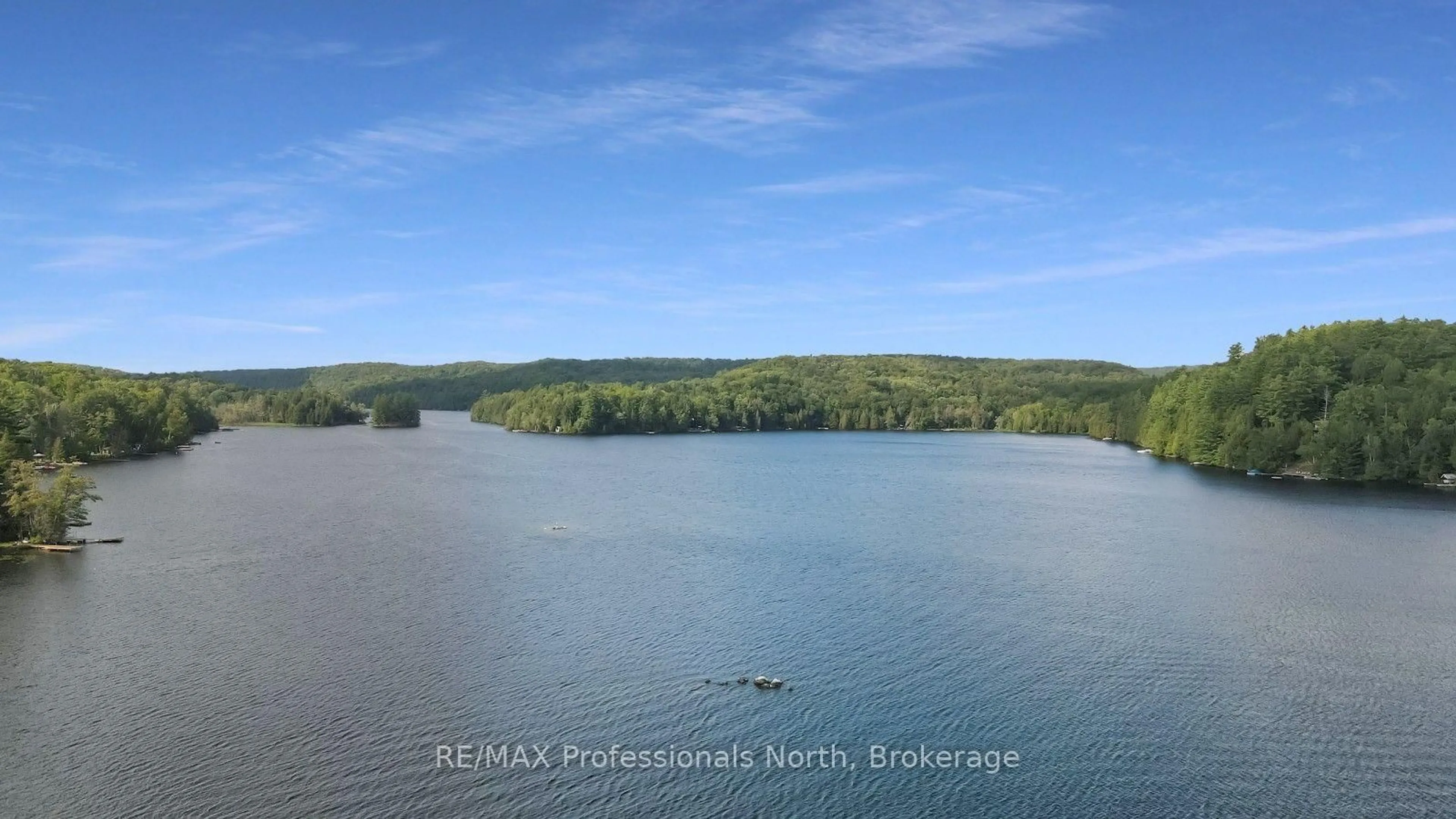 A pic from outside/outdoor area/front of a property/back of a property/a pic from drone, water/lake/river/ocean view for 1017 Pickerel Lane, Highlands East Ontario K0M 1X0