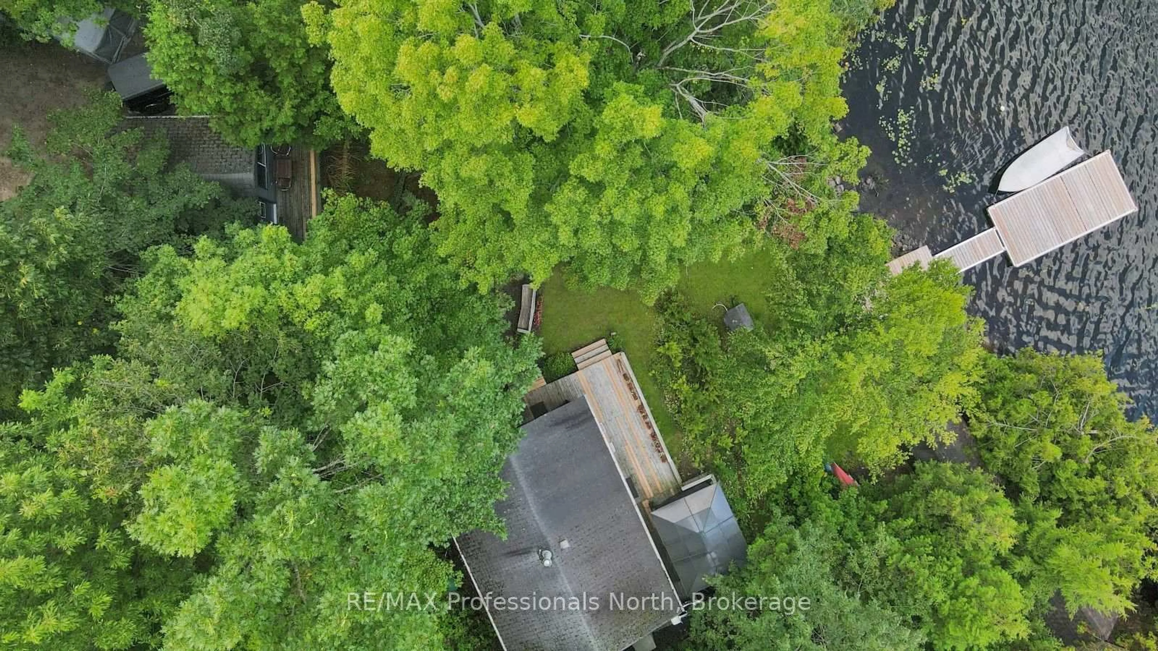 A pic from outside/outdoor area/front of a property/back of a property/a pic from drone, forest/trees view for 1017 Pickerel Lane, Highlands East Ontario K0M 1X0