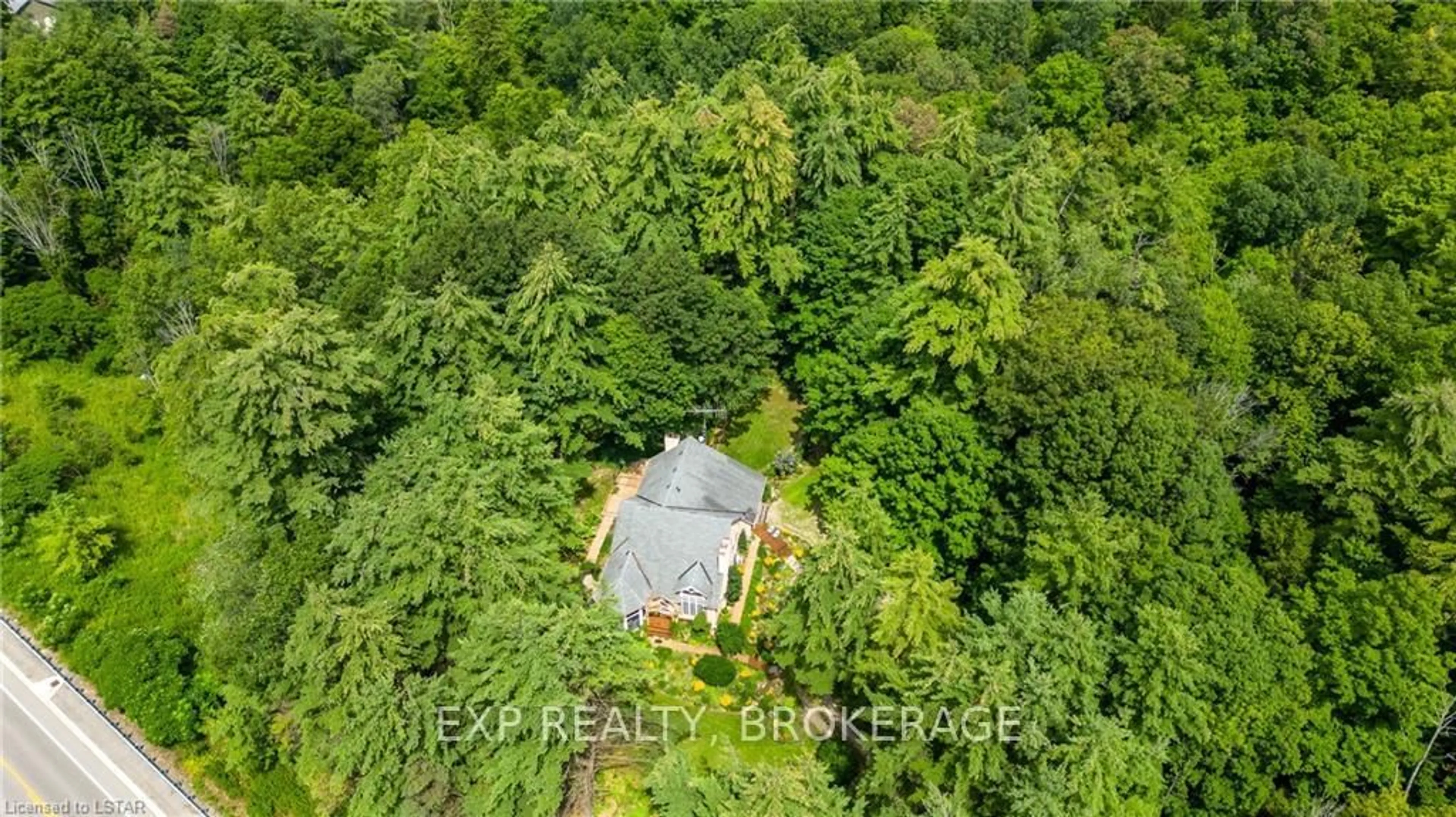 A pic from outside/outdoor area/front of a property/back of a property/a pic from drone, forest/trees view for 55516 Heritage Line, Bayham Ontario N0J 1Y0