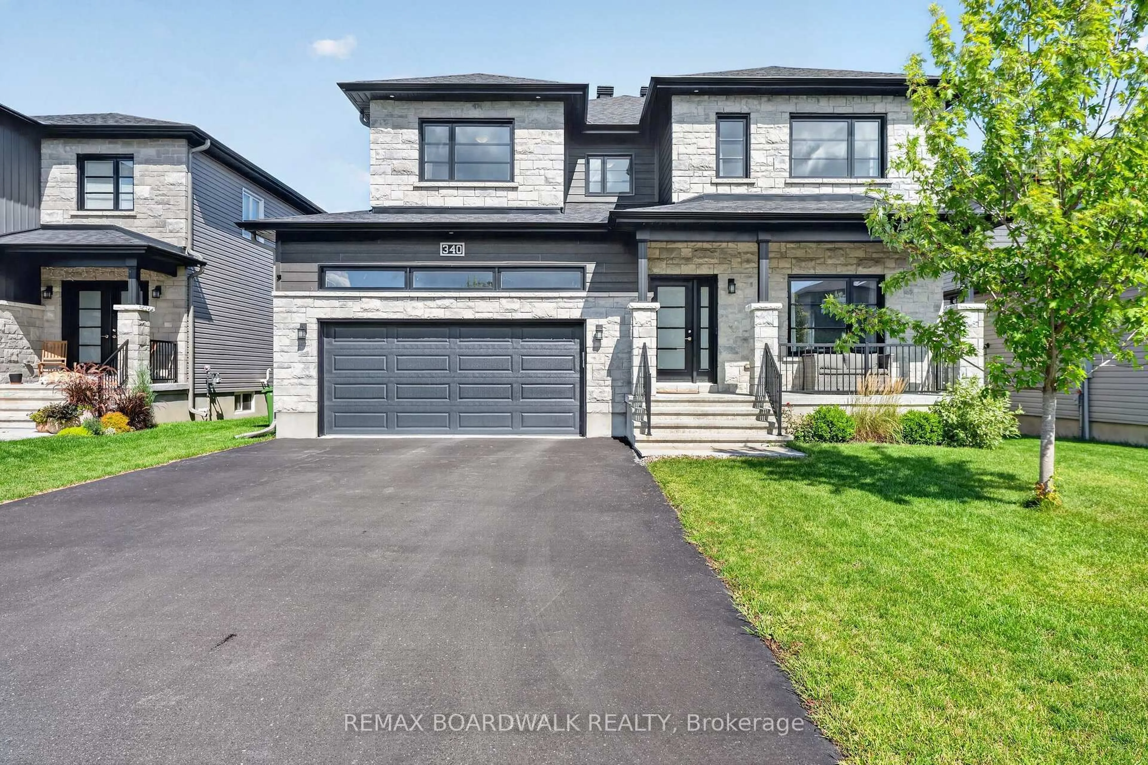 Home with vinyl exterior material, street for 340 Moonlight Dr, Russell Ontario K4R 0L1