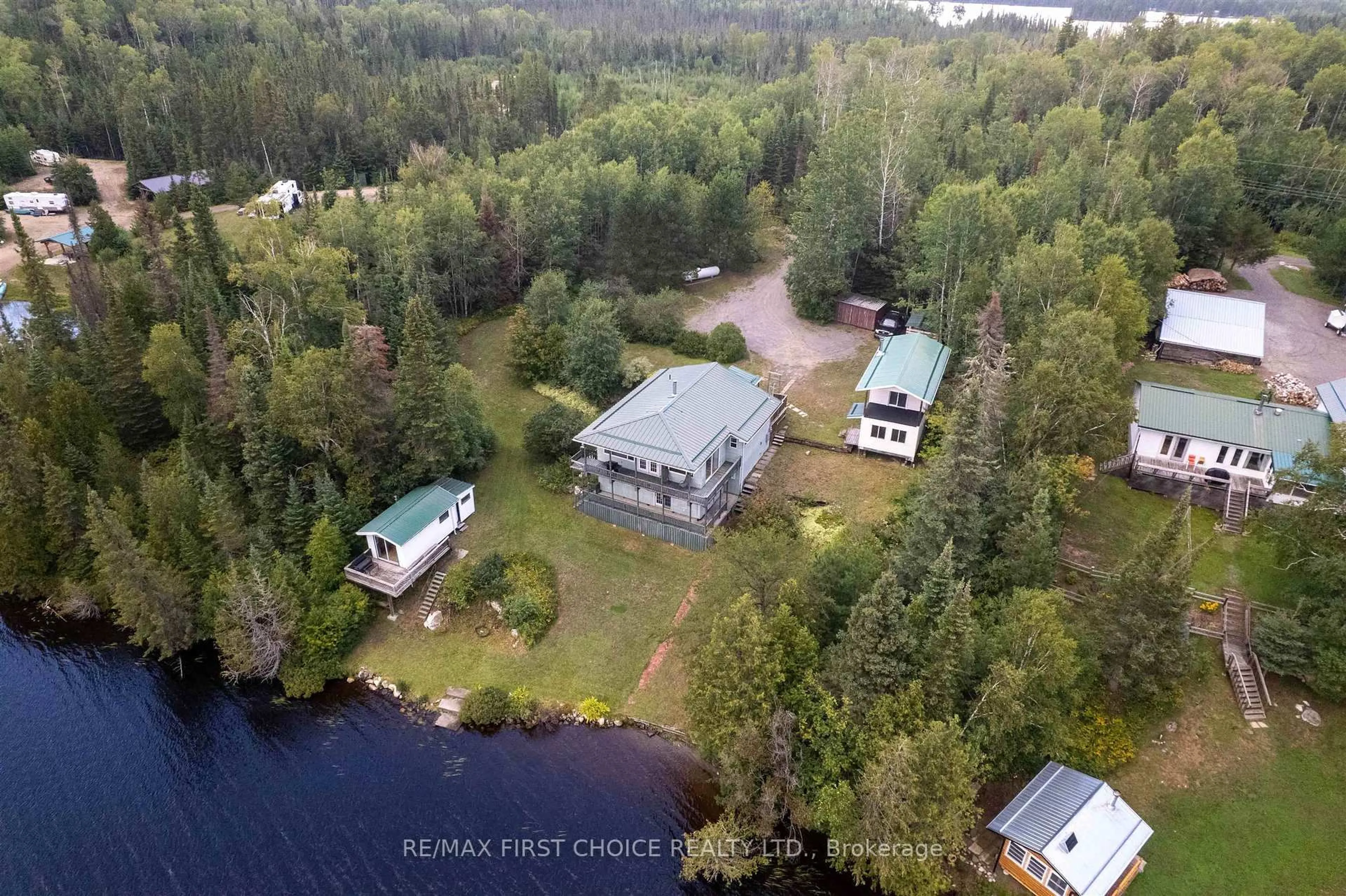 A pic from outside/outdoor area/front of a property/back of a property/a pic from drone, water/lake/river/ocean view for 32I One Island Lake Rd, Thunder Bay Remote Area Ontario P7G 0W4