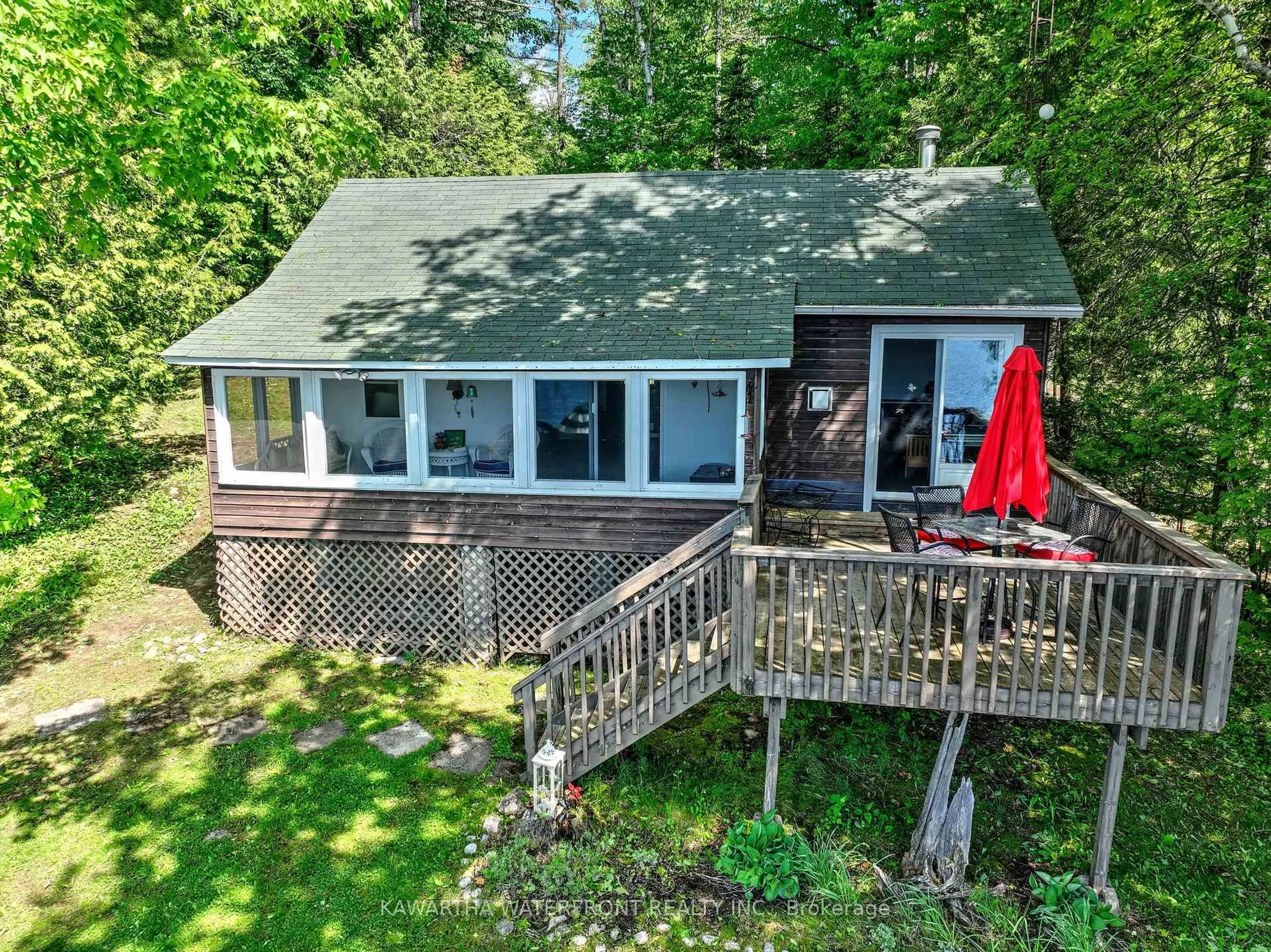 A pic from outside/outdoor area/front of a property/back of a property/a pic from drone, water/lake/river/ocean view for 93 West Clear Bay Rd, Trent Lakes Ontario K0M 2A0