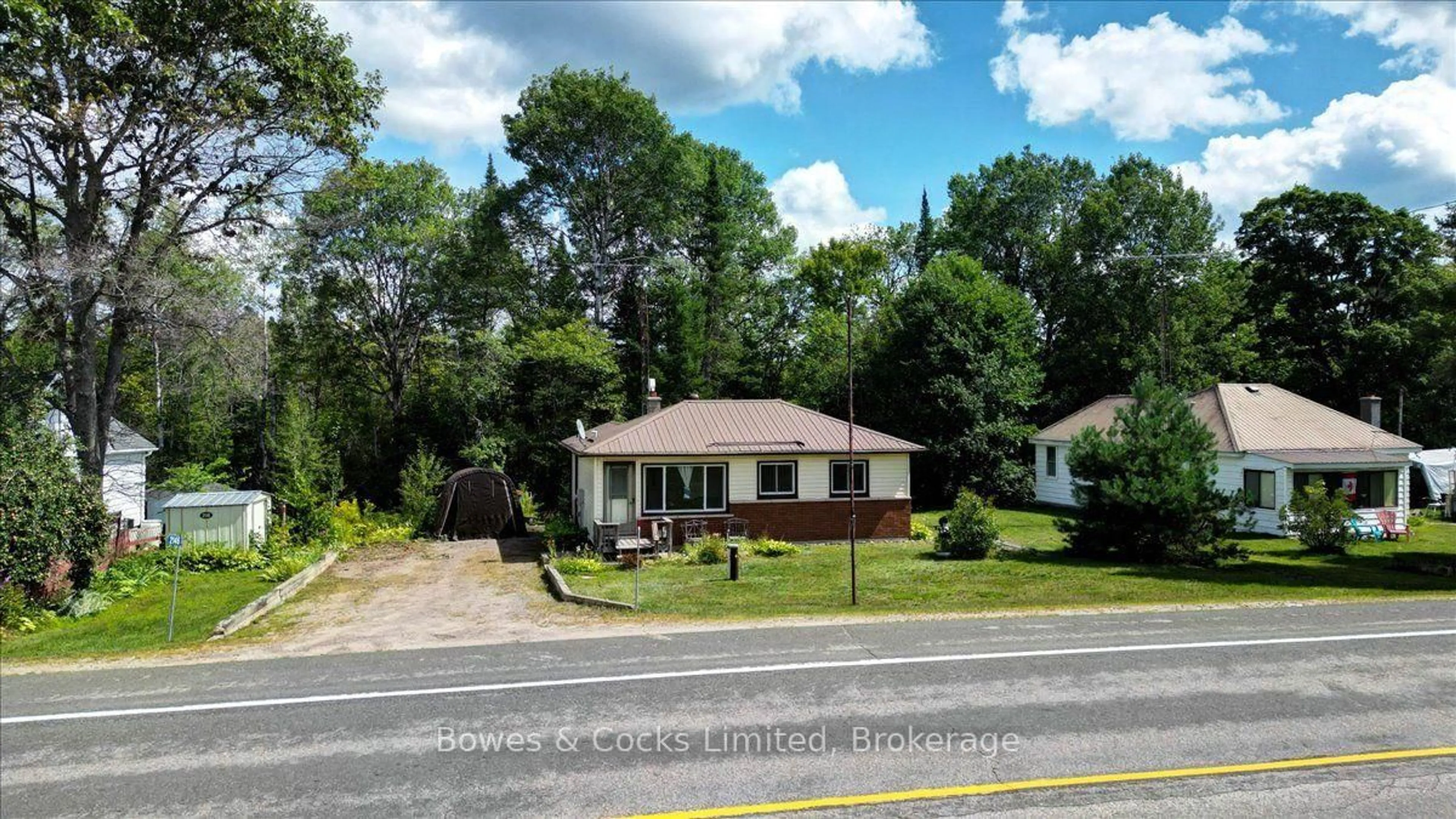 A pic from outside/outdoor area/front of a property/back of a property/a pic from drone, street for 2146 Loop Rd, Highlands East Ontario K0L 2Y0