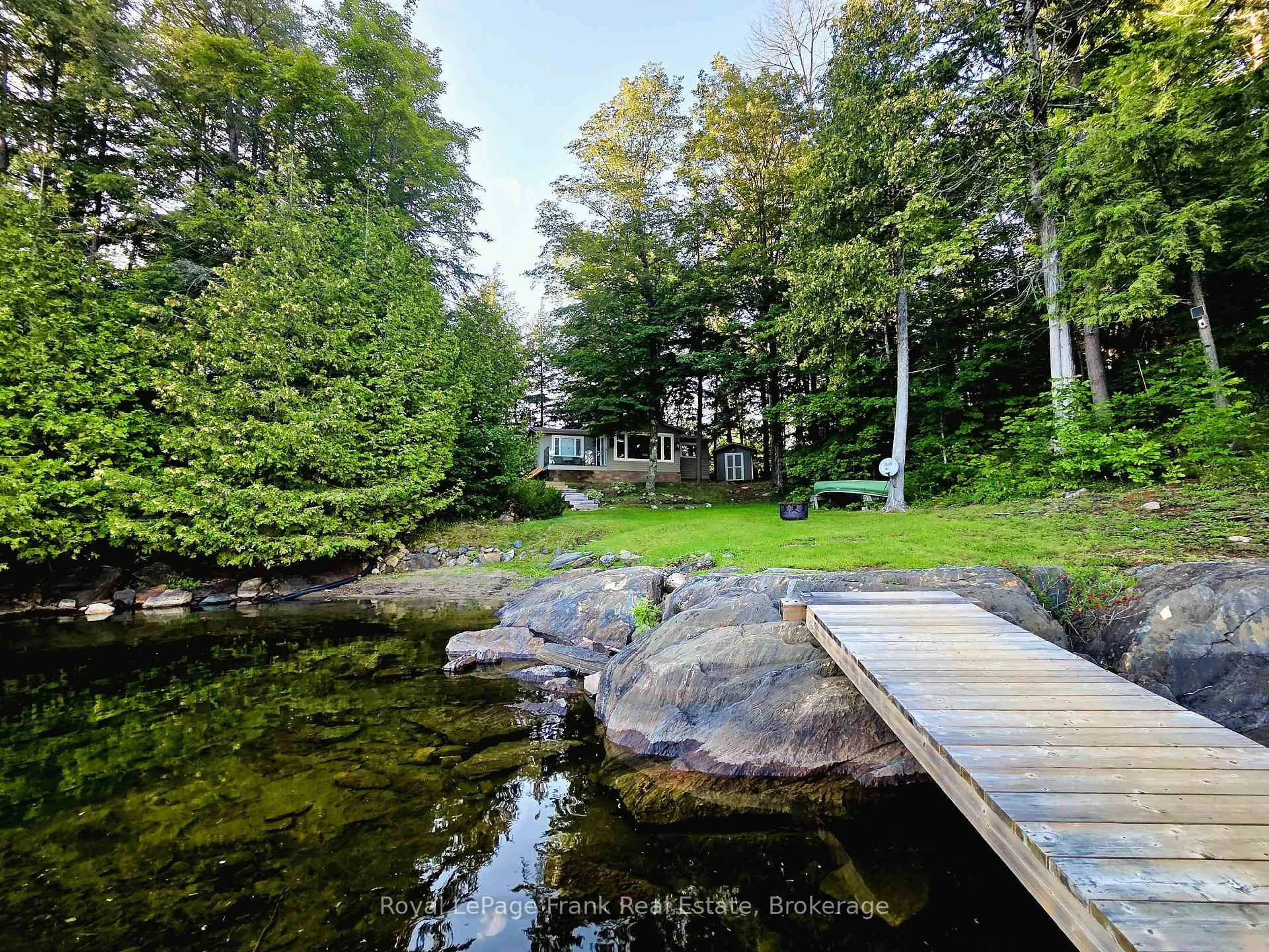 A pic from outside/outdoor area/front of a property/back of a property/a pic from drone, water/lake/river/ocean view for 42 Jade Crt, Coe Hill Ontario K0L 1P0