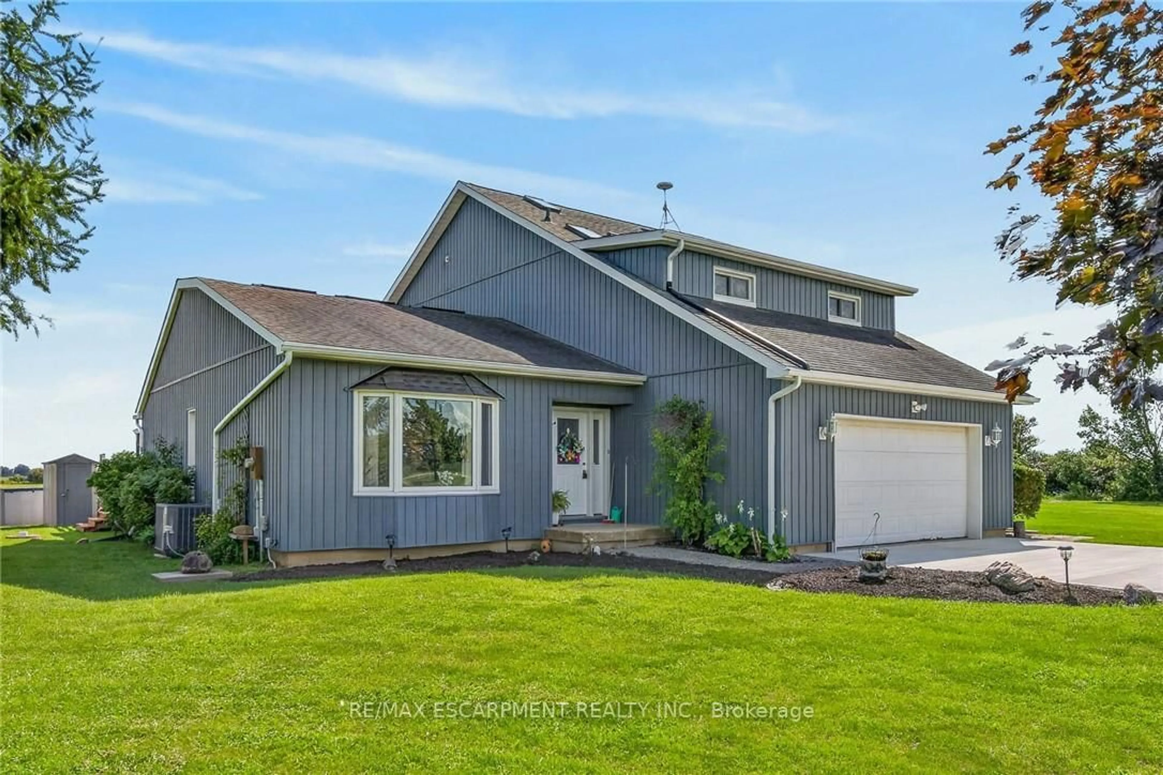 Home with vinyl exterior material, street for 450 Concession 6 Rd, Haldimand Ontario N0A 1G0