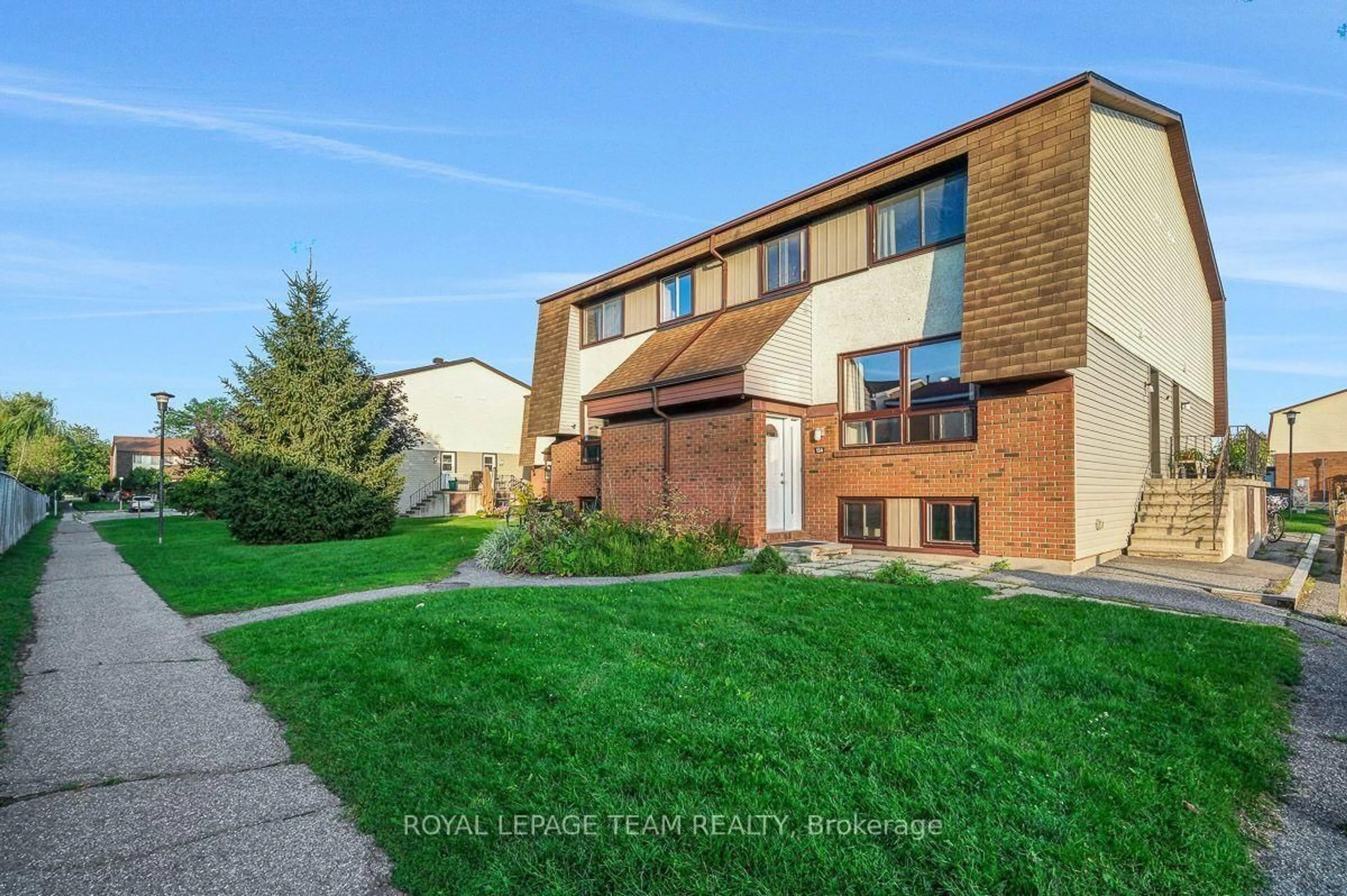 Home with brick exterior material, street for 13 Woodvale Green Dr #100, Ottawa Ontario K2G 4H1