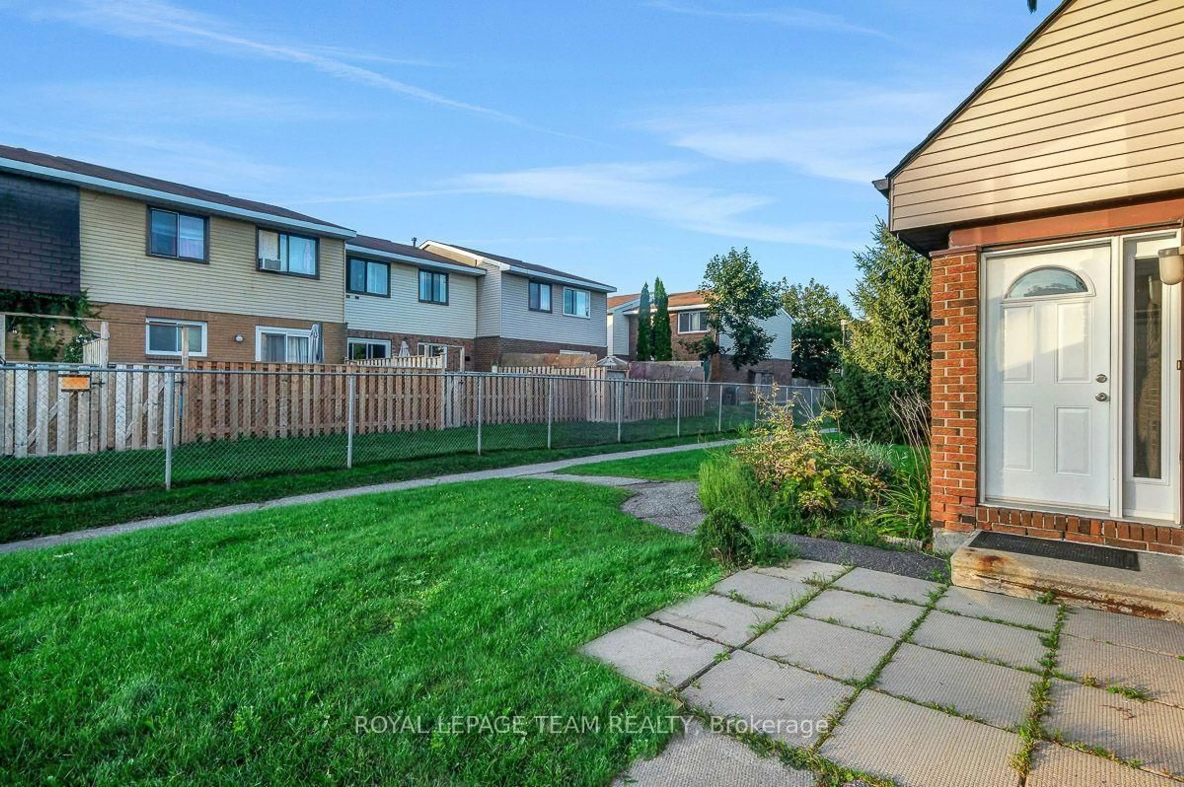 A pic from outside/outdoor area/front of a property/back of a property/a pic from drone, street for 13 Woodvale Green Dr #100, Ottawa Ontario K2G 4H1