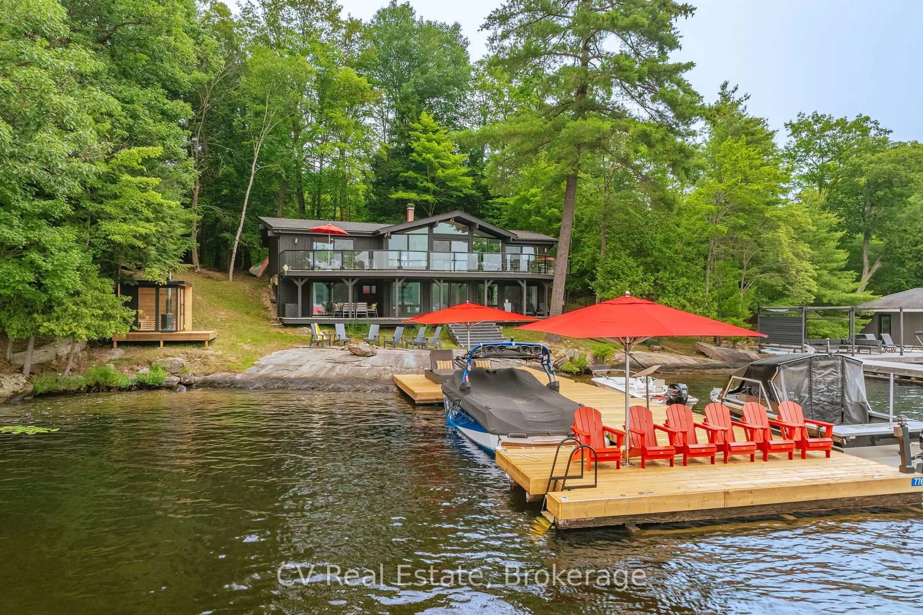 A pic from outside/outdoor area/front of a property/back of a property/a pic from drone, water/lake/river/ocean view for 776 Eileen Gowan Island, Bracebridge Ontario P1L 1X6