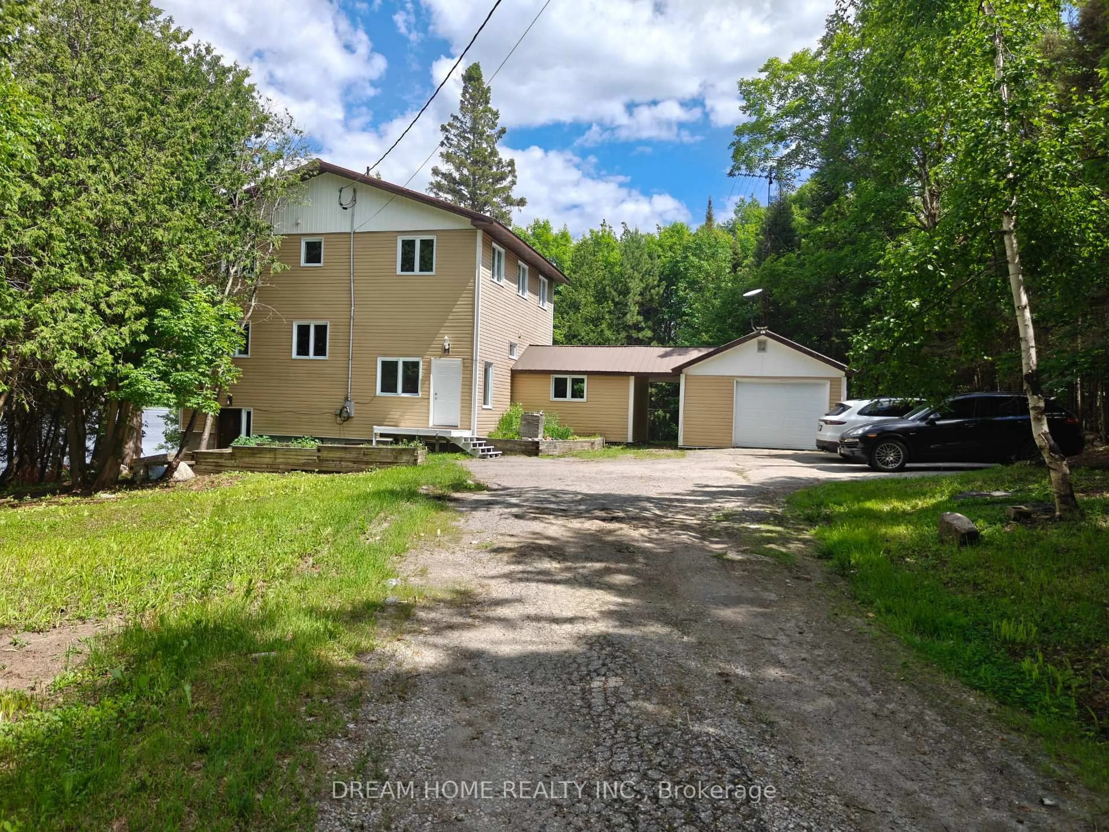 A pic from outside/outdoor area/front of a property/back of a property/a pic from drone, street for 150 Hillside Lake Rd, North Bay Ontario P1B 8G2