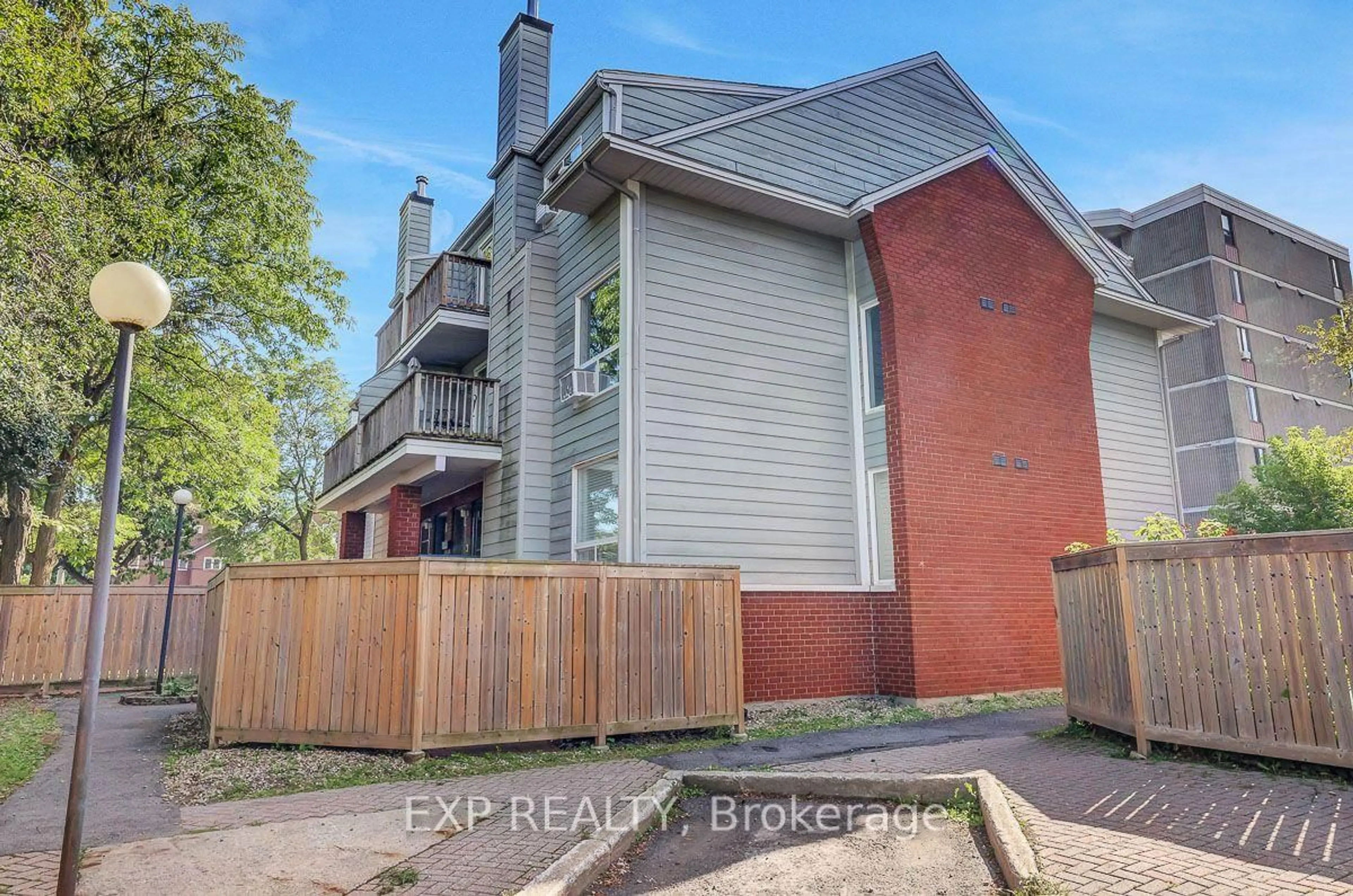 A pic from outside/outdoor area/front of a property/back of a property/a pic from drone, street for 20 Hart Ave #F, Ottawa Ontario K1K 4H8