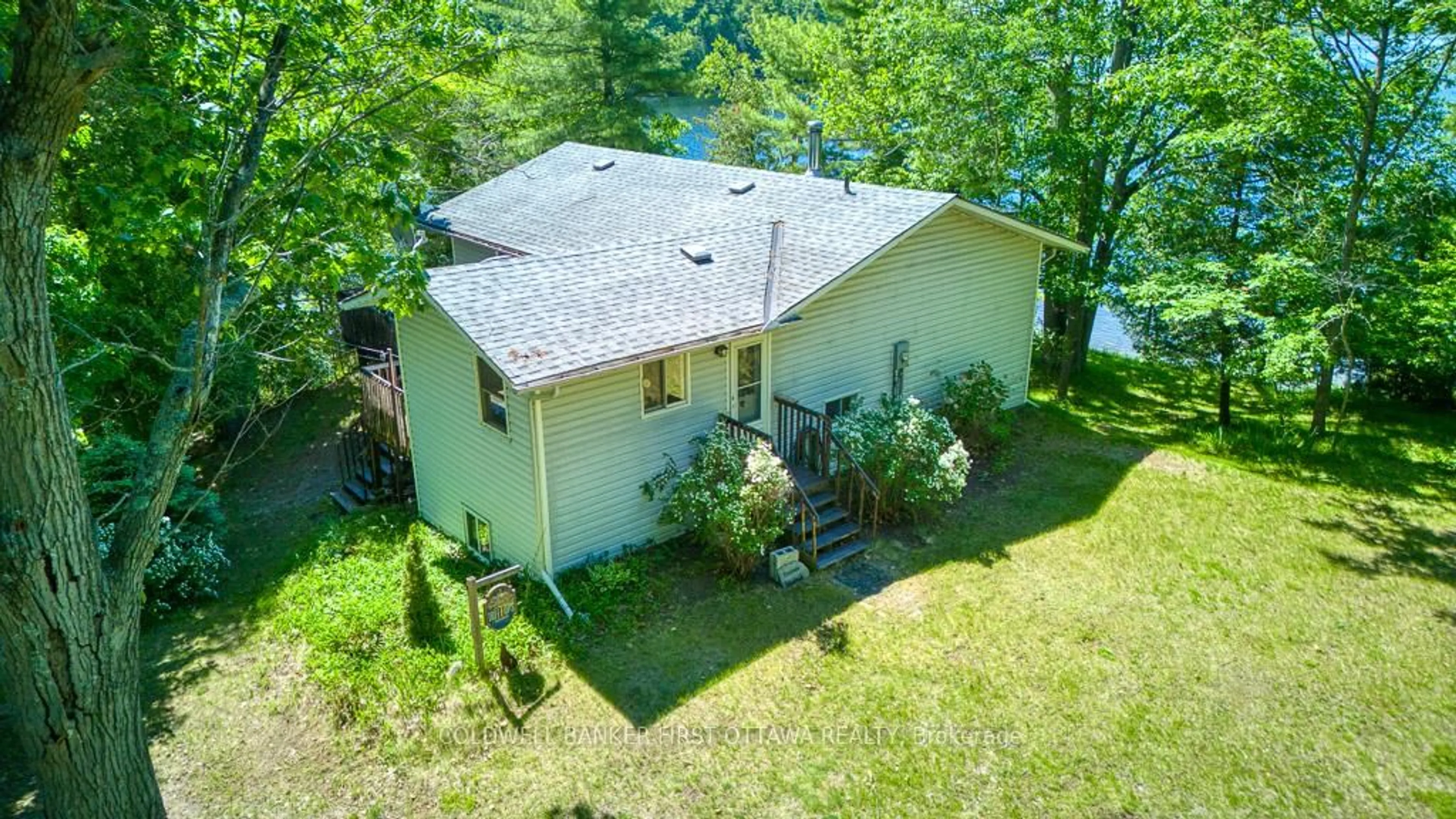 A pic from outside/outdoor area/front of a property/back of a property/a pic from drone, water/lake/river/ocean view for 1301 D Guigue Rd, Sharbot Lake Ontario K0H 2P0