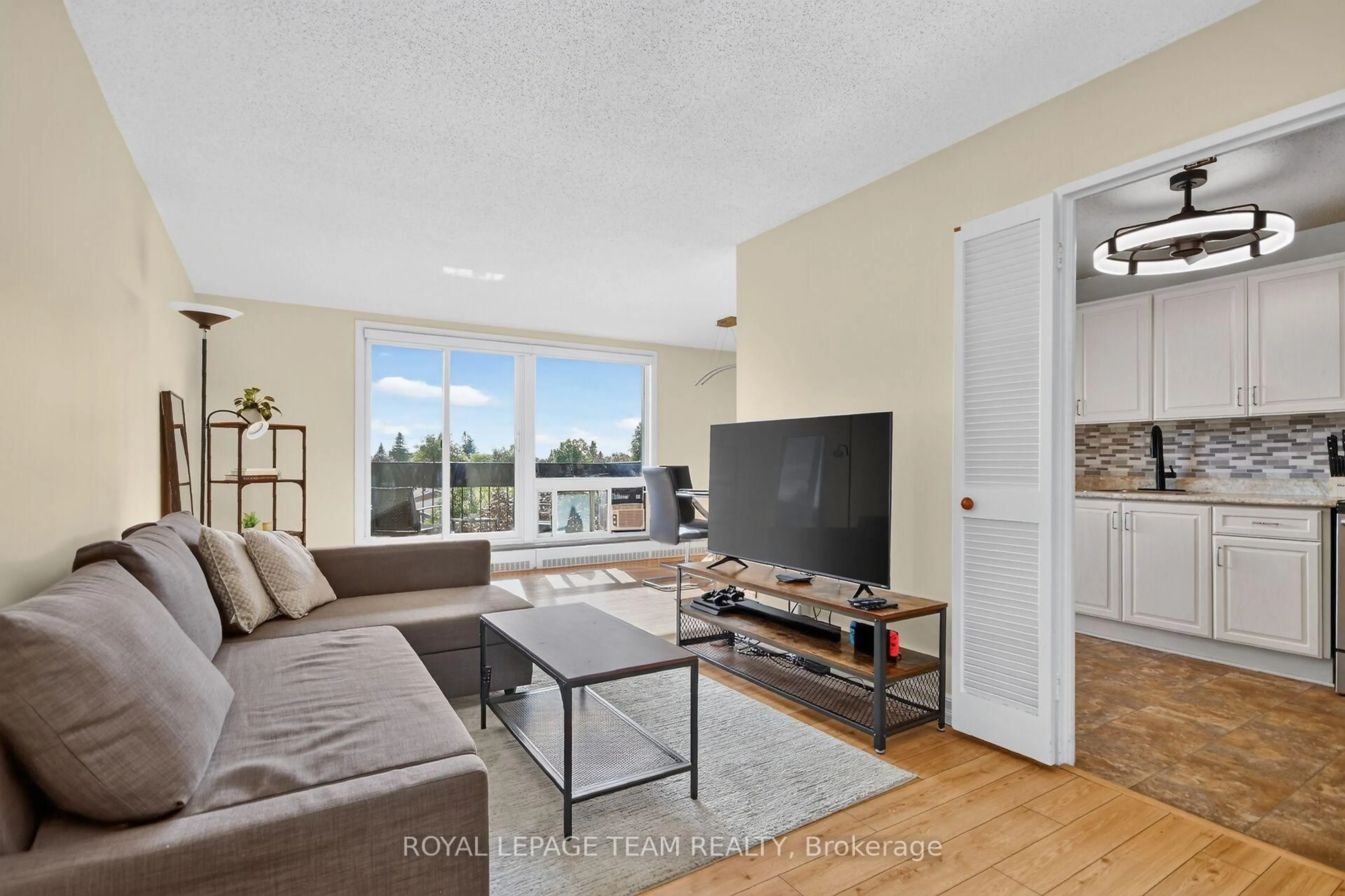 Living room with furniture, unknown for 1505 Baseline Rd #412, Ottawa Ontario K2C 3L4