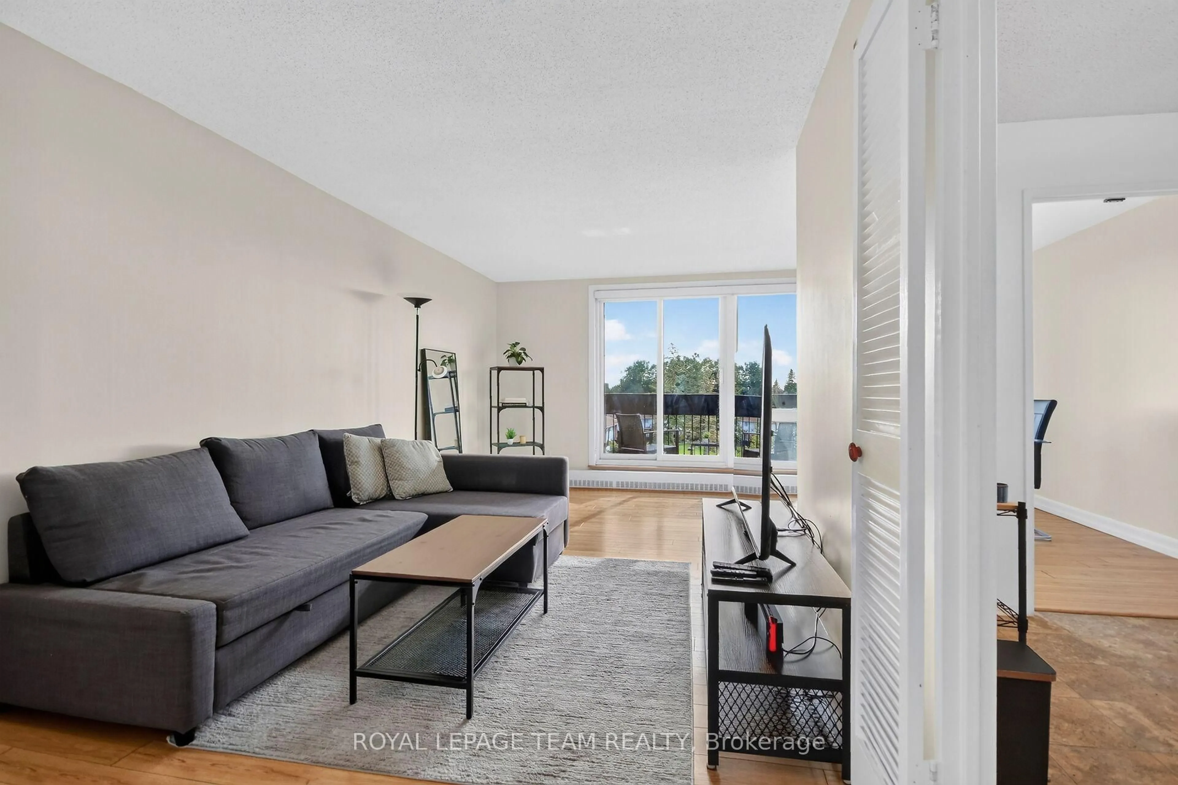 Living room with furniture, unknown for 1505 Baseline Rd #412, Ottawa Ontario K2C 3L4