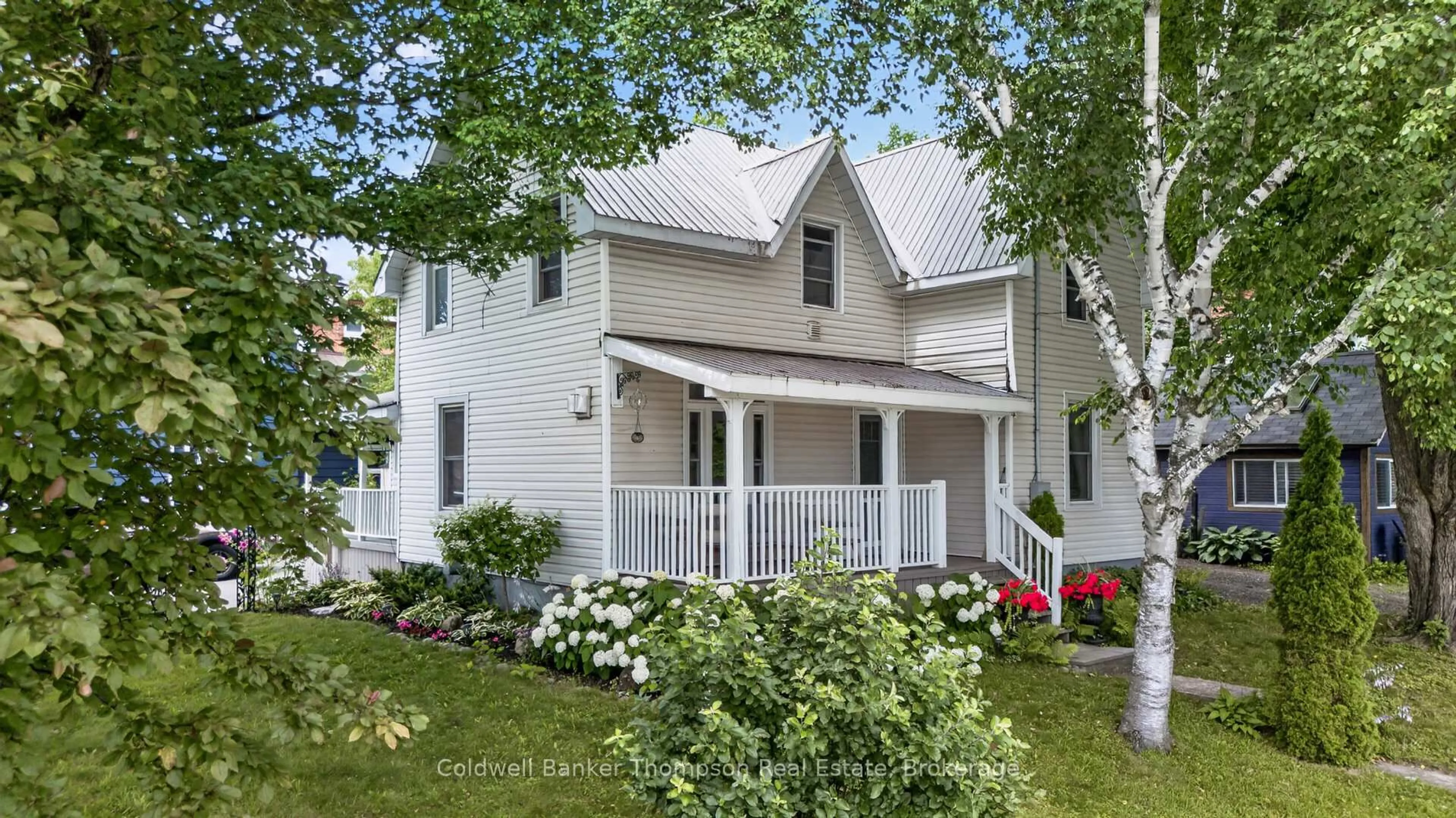 Home with vinyl exterior material, street for 12 Caroline St, Huntsville Ontario P1H 2B4