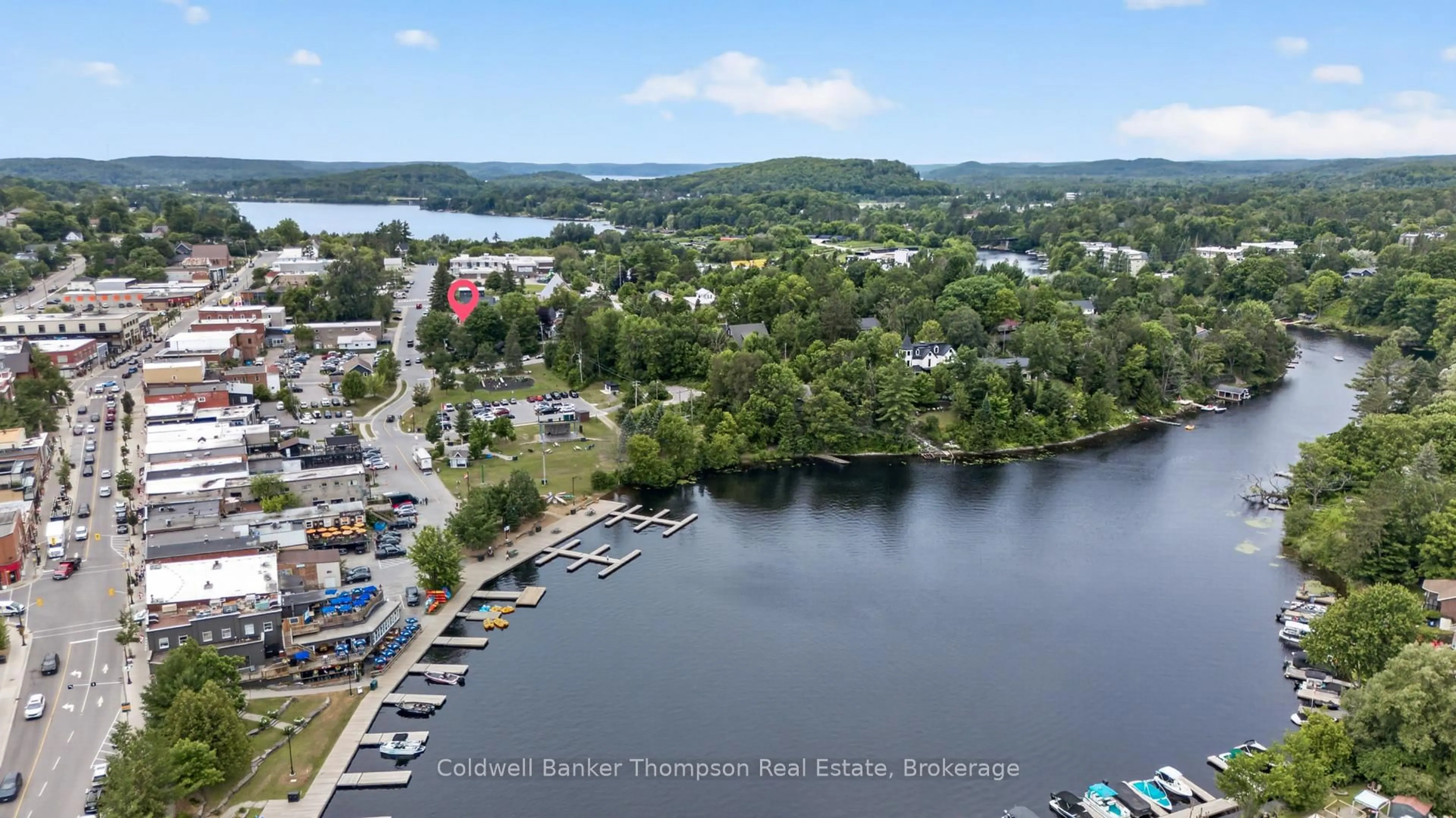 A pic from outside/outdoor area/front of a property/back of a property/a pic from drone, water/lake/river/ocean view for 12 Caroline St, Huntsville Ontario P1H 2B4