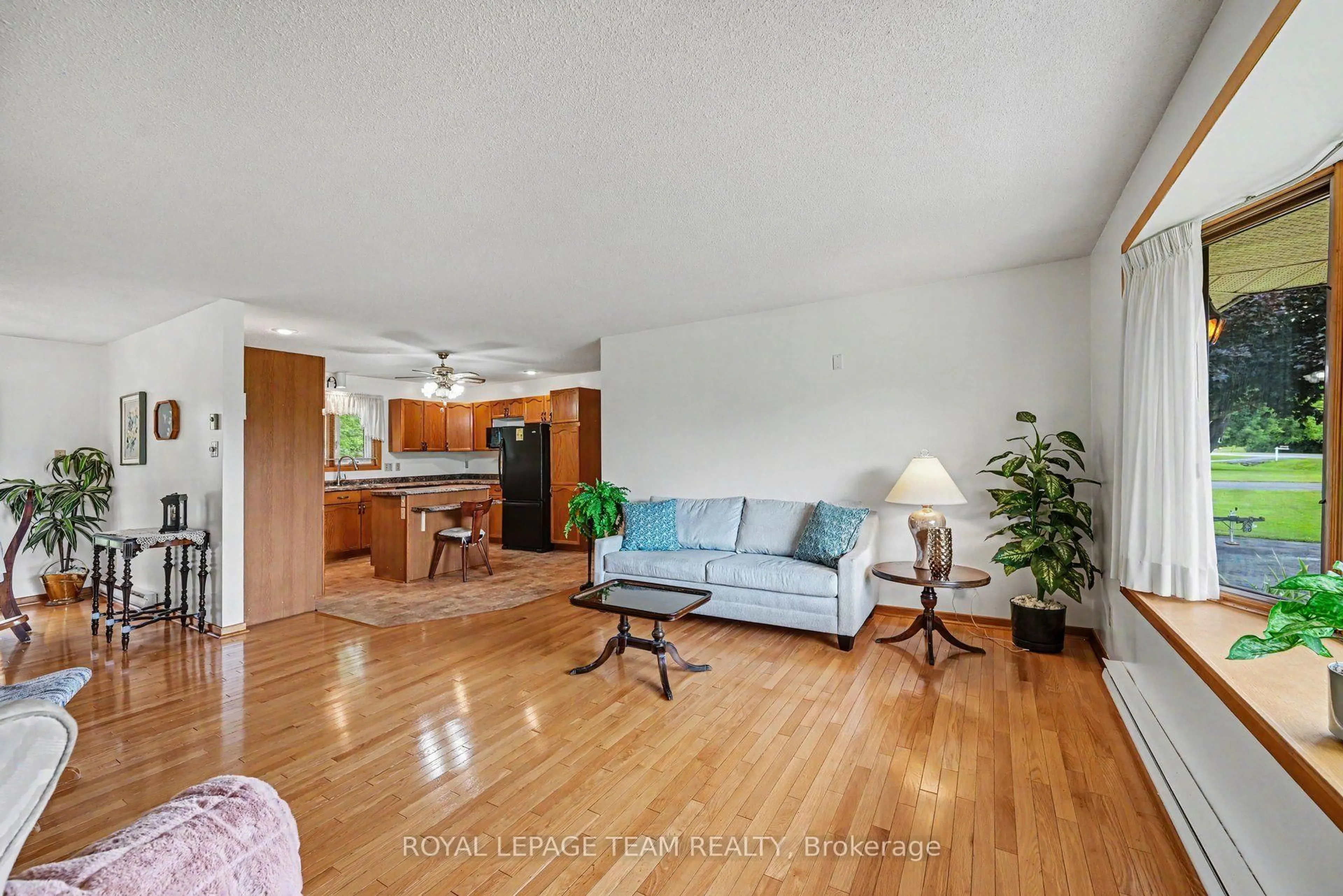 Living room with furniture, wood/laminate floor for 5630 Saver Rd, South Dundas Ontario K0E 1K0