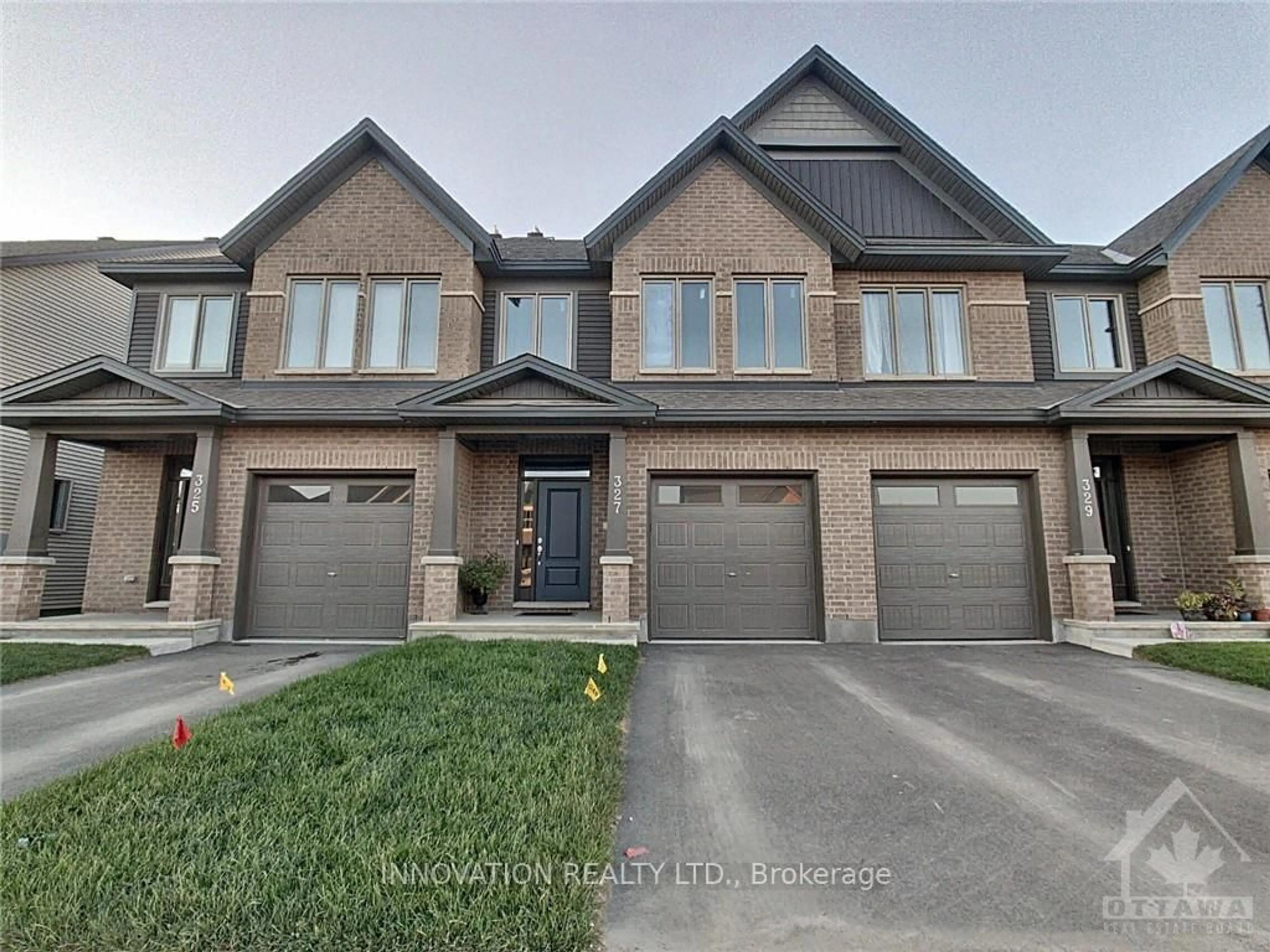 Home with brick exterior material, street for 327 Barrett Farm Dr, Ottawa Ontario K1T 0S3