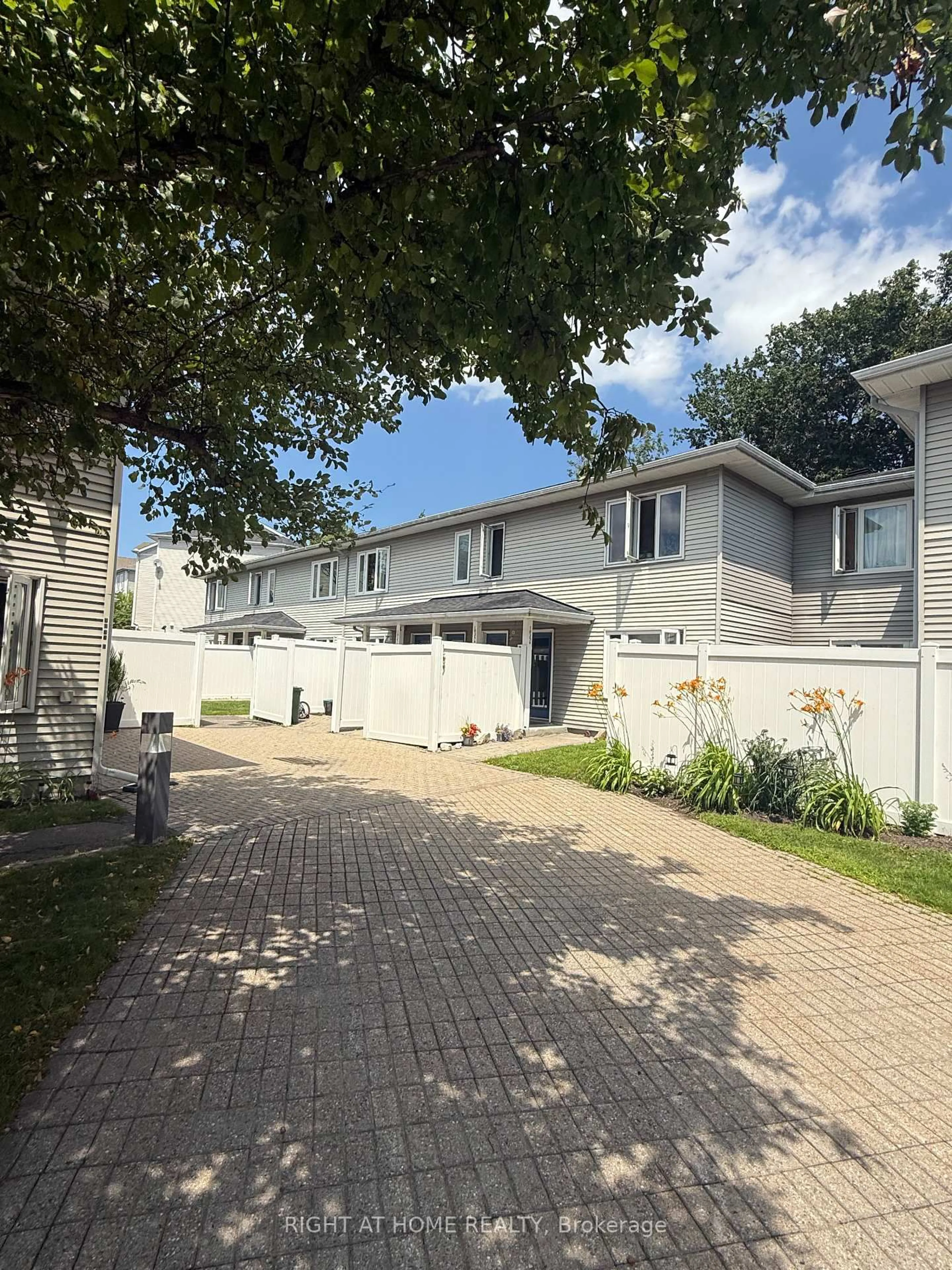 A pic from outside/outdoor area/front of a property/back of a property/a pic from drone, street for 1035 Cummings Ave #B, Ottawa Ontario K1J 9K5