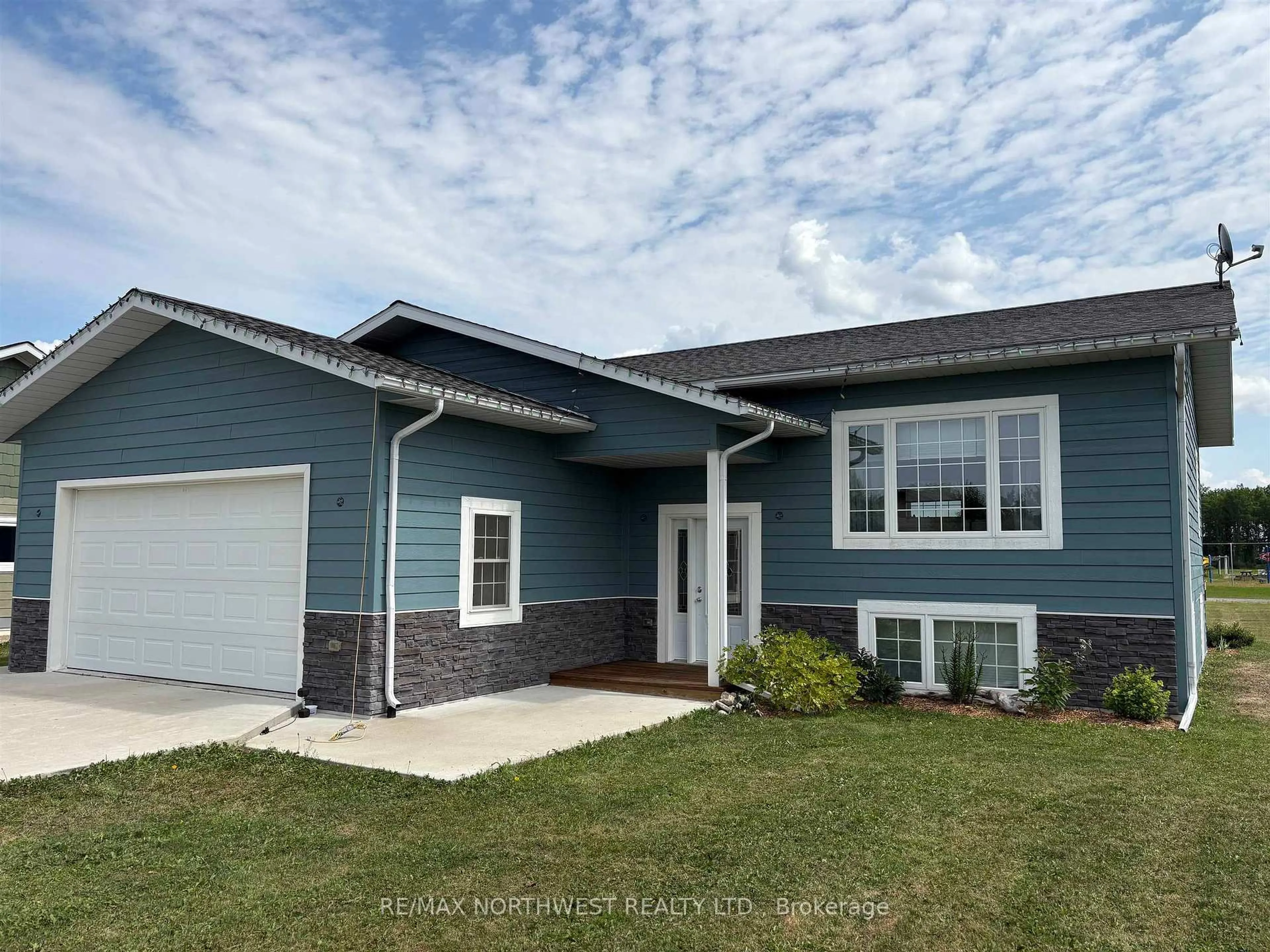 Home with vinyl exterior material, street for 8 Spruce Dr, Emo Ontario P0W 1E0