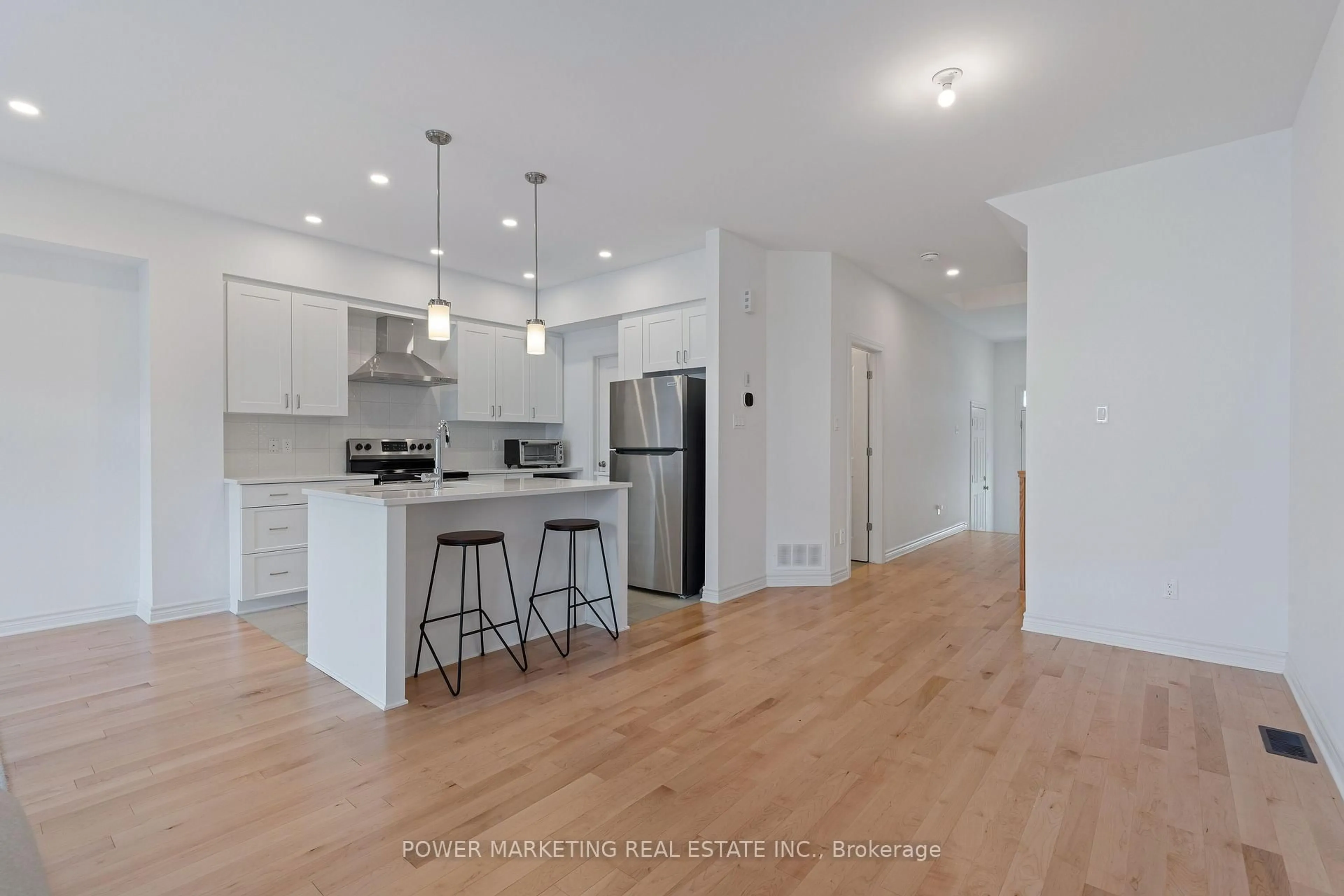 Open concept kitchen, wood/laminate floor for 677 Cordelette Circ, Ottawa Ontario K1W 0P2