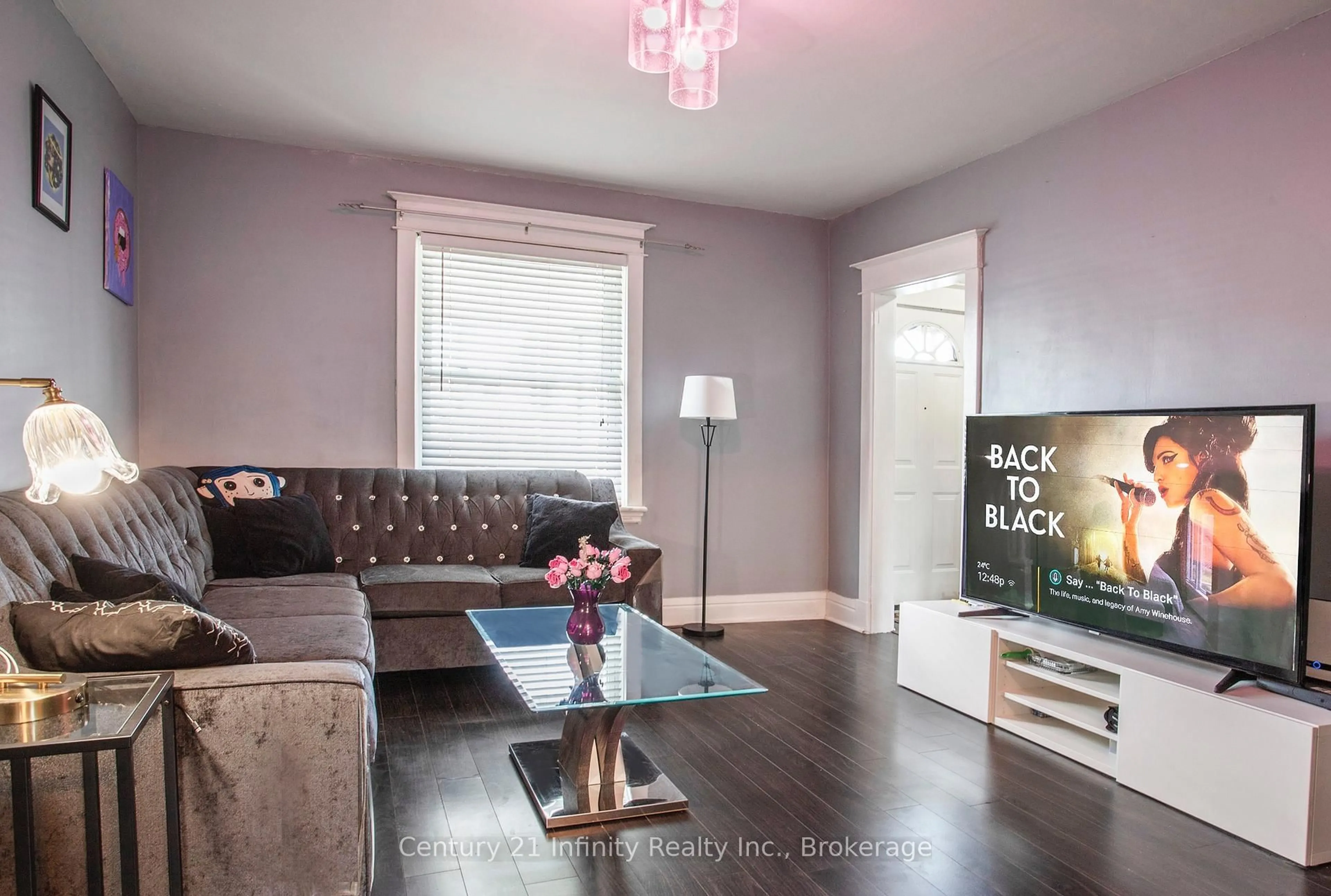 Living room with furniture, wood/laminate floor for 128 Birch Ave, Hamilton Ontario L8L 6H7