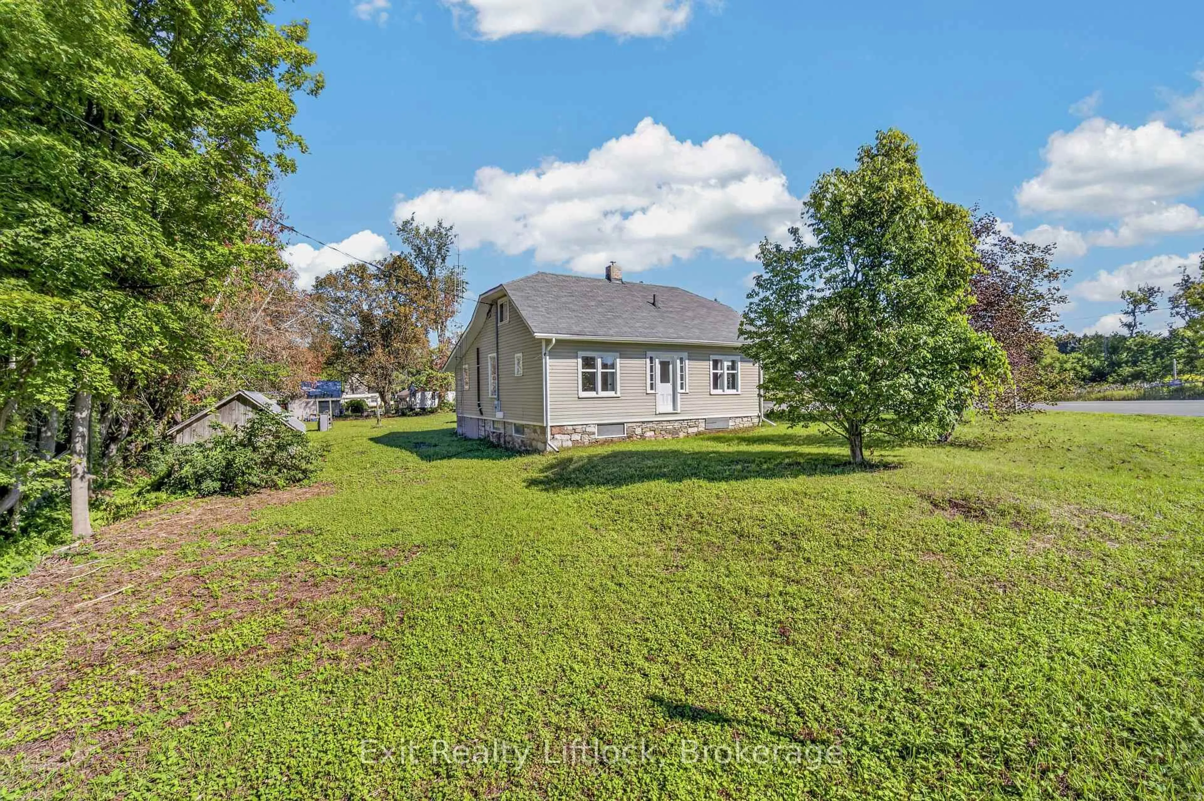 A pic from outside/outdoor area/front of a property/back of a property/a pic from drone, water/lake/river/ocean view for 1952 County Rd 6 Rd, Douro-Dummer Ontario K0L 2H0