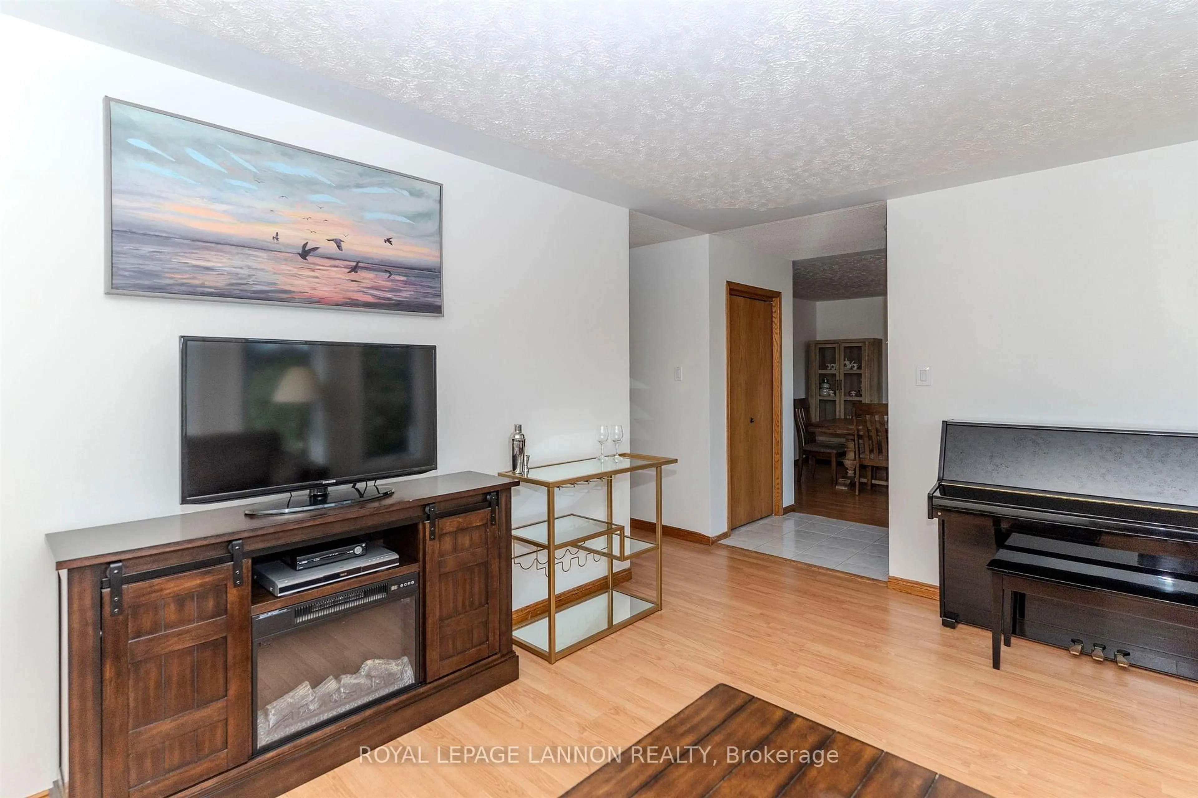 Living room with furniture, wood/laminate floor for 49 Wasco Dr, Thunder Bay Ontario P7G 1A2